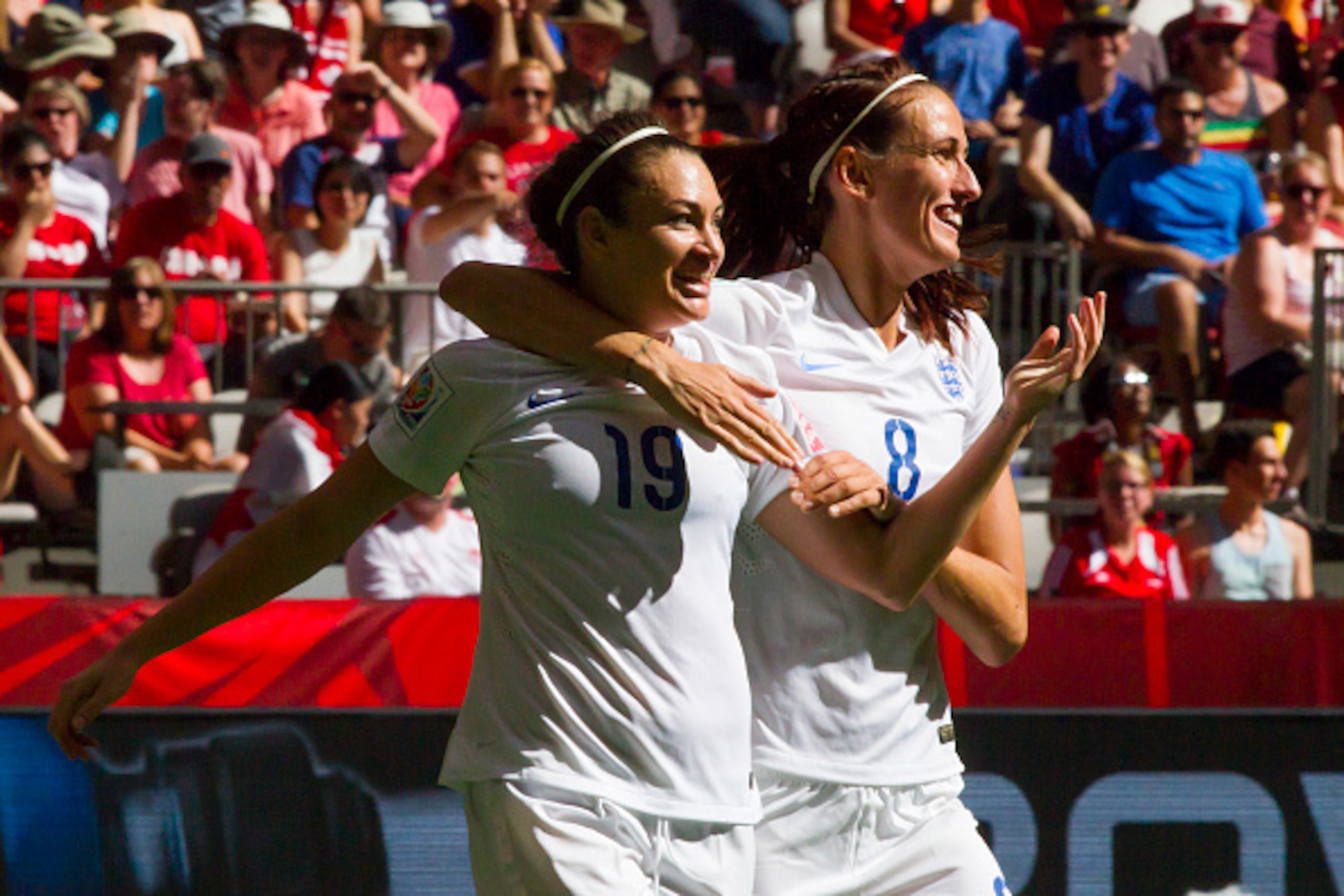 VANCOUVER, BC - JUNE 27: Jodie Taylor #19 of England celebrates her goal against Canada with teammate Jill Scott #8 during the FIFA Women's World Cup Canada 2015 Quarter Final match between the England and Canada June 27, 2015 at BC Place Stadium in Vanco