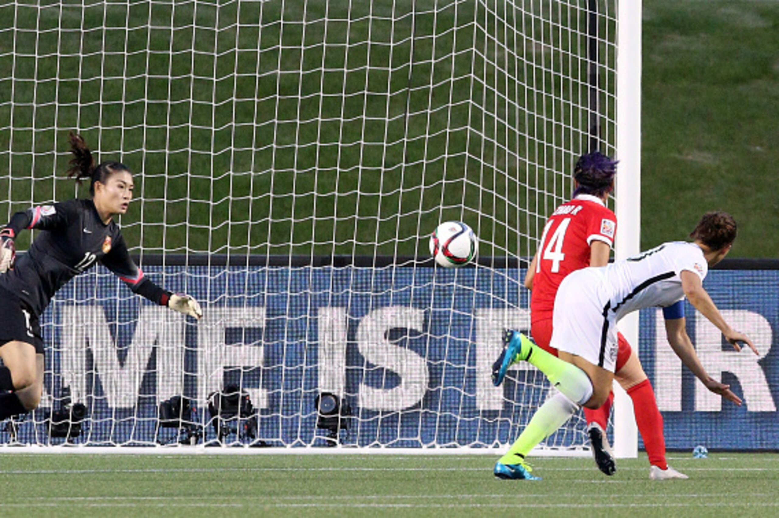 OTTAWA, ON - JUNE 26: Carli Lloyd #10 of the United States heads the ball past goalkeeper Wang Fei #12 of China in the second half for her team's first goal in the FIFA Women's World Cup 2015 Quarter Final match at Lansdowne Stadium on June 26, 2015 in Ot