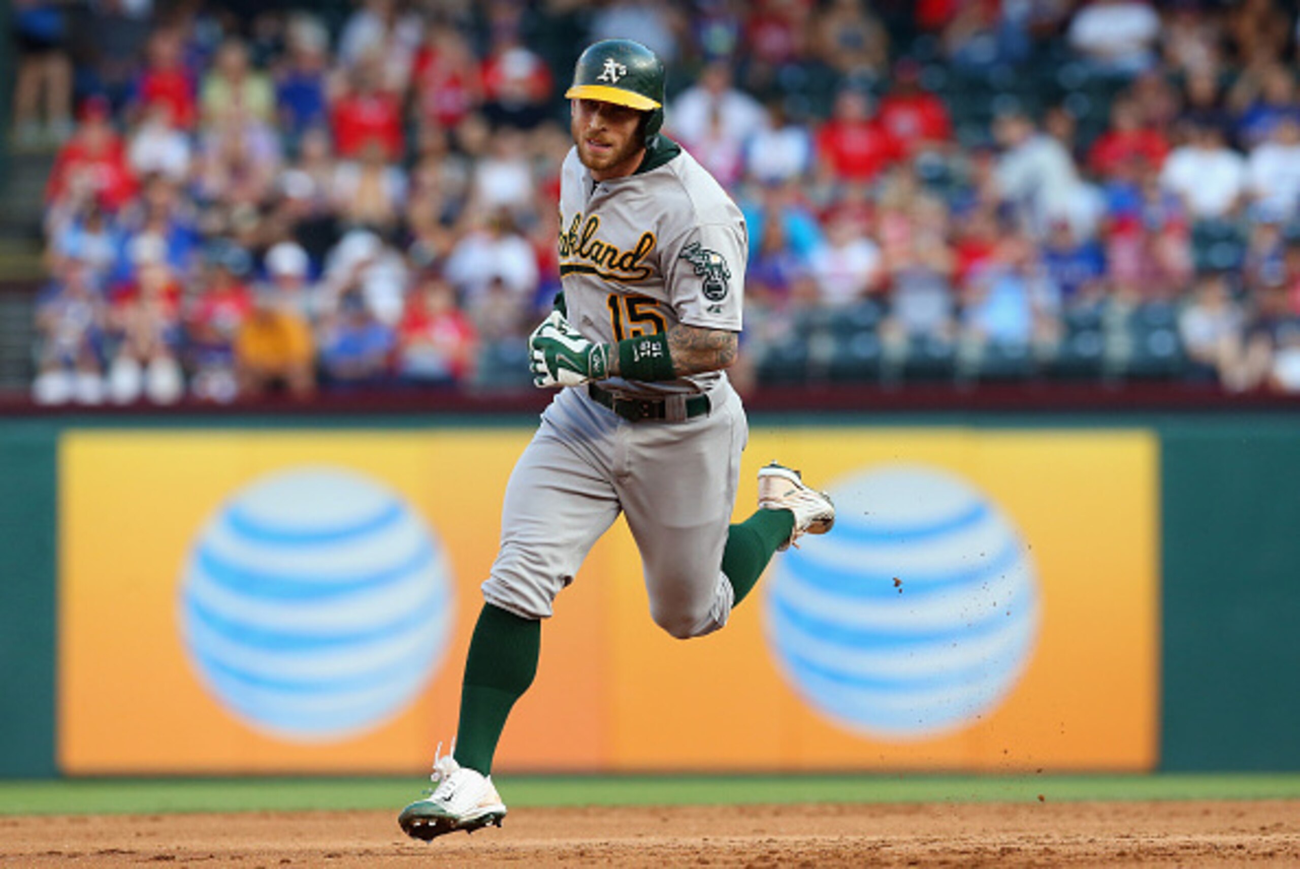 ARLINGTON, TX - JUNE 24:  Brett Lawrie #15 of the Oakland Athletics runs the bases after hitting a grand slam in the first inning against the Texas Rangers at Globe Life Park in Arlington on June 24, 2015 in Arlington, Texas.  (Photo by Ronald Martinez/Ge