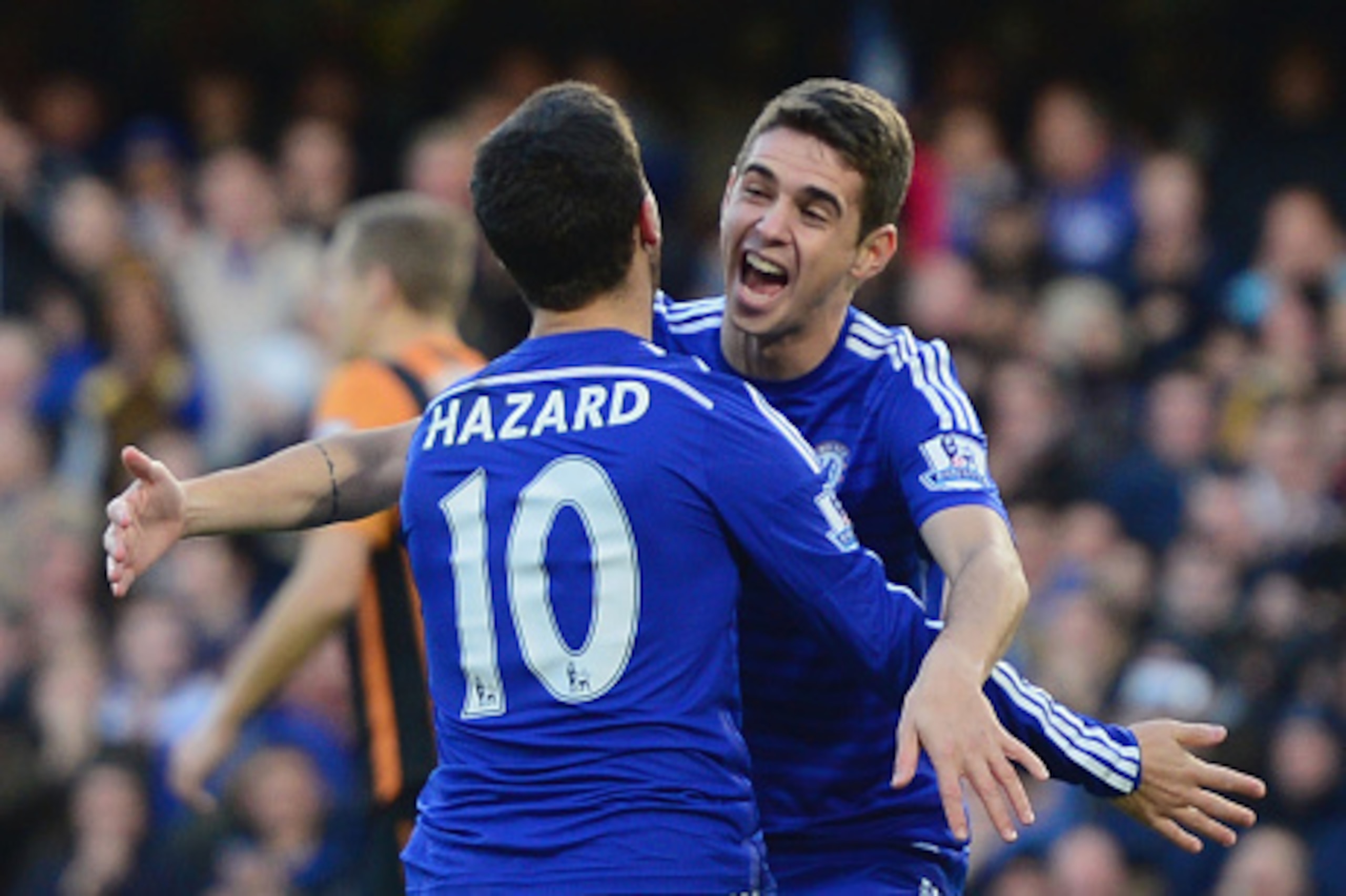 LONDON, ENGLAND - DECEMBER 13:  Eden Hazard of Chelsea (10) celebrates with Oscar as he scores their first goal  during the Barclays Premier League match between Chelsea and Hull City at Stamford Bridge on December 13, 2014 in London, England.  (Photo by 