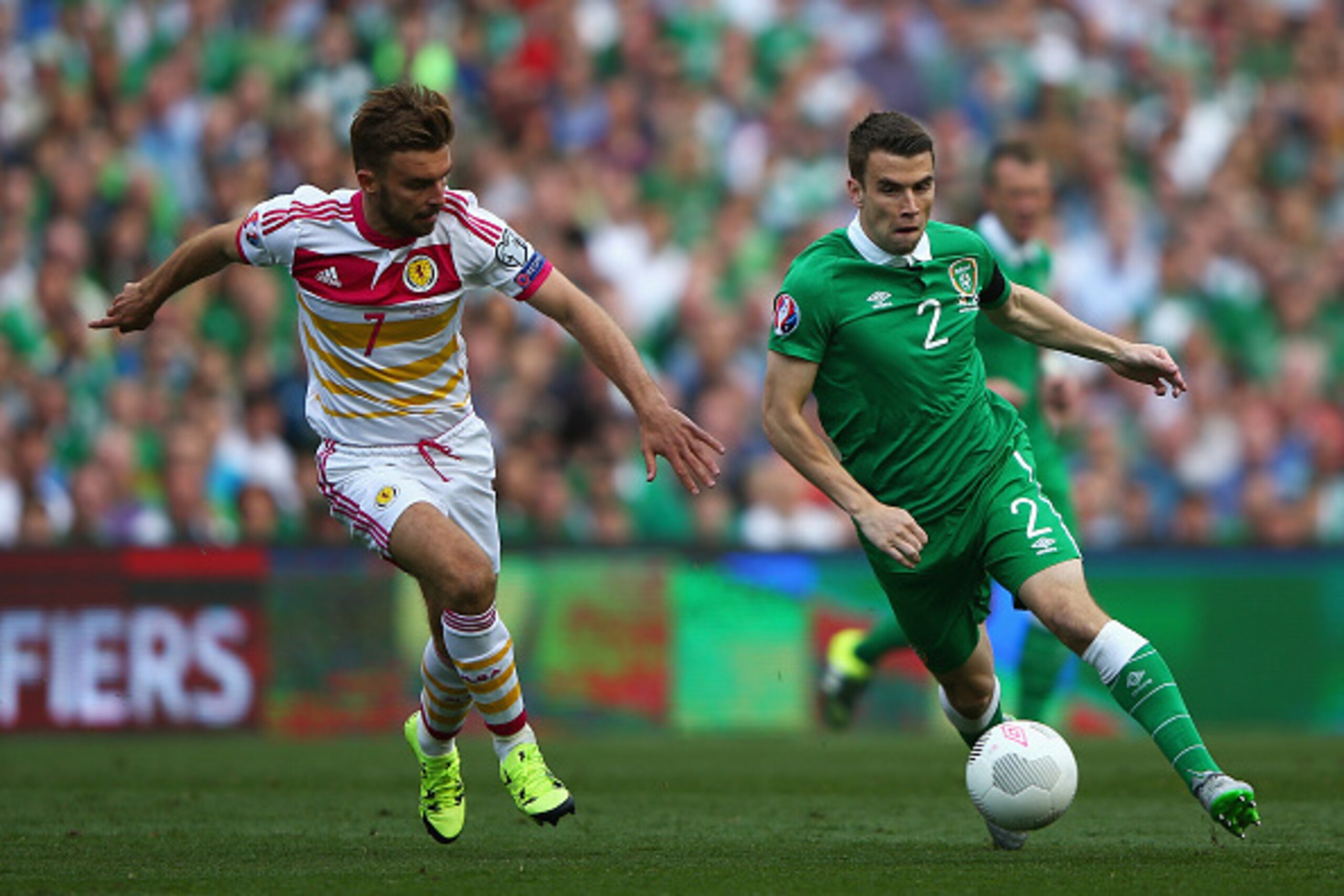 DUBLIN, IRELAND - JUNE 13:  Seamus Coleman of Republic of Ireland takes on James Morrison of Scotland during the UEFA EURO 2016 Qualifier Group D match between Republic of Ireland and Scotland at Aviva Stadium on June 13, 2015 in Dublin, Ireland.  (Photo 