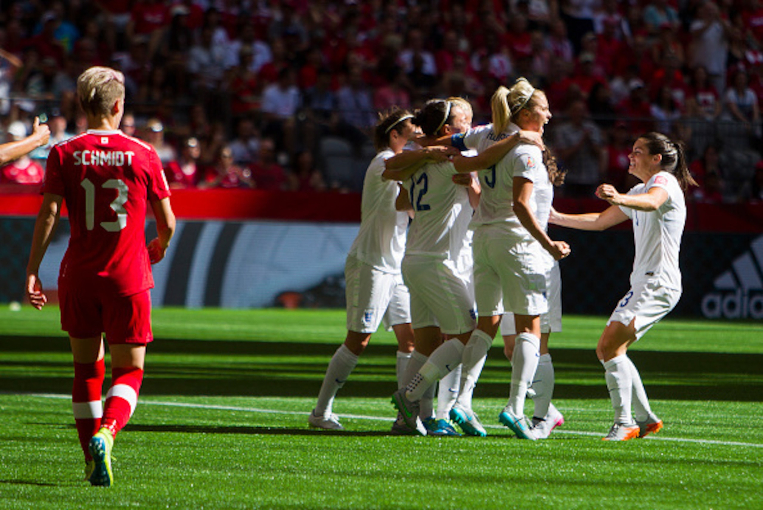 VANCOUVER, BC - JUNE 27: Steph Houghton #5 celebrates teammate Karen Carney #10 of England's goal against Canada during the FIFA Women's World Cup Canada 2015 Quarter Final match between the England and Canada June 27, 2015 at BC Place Stadium in Vancouve VANCOUVER, BC - JUNE 27: Steph Houghton #5 celebrates teammate Karen Carney #10 of England's goal against Canada during the FIFA Women's World Cup Canada 2015 Quarter Final match between the England and Canada June 27, 2015 at BC Place Stadium in Vancouve