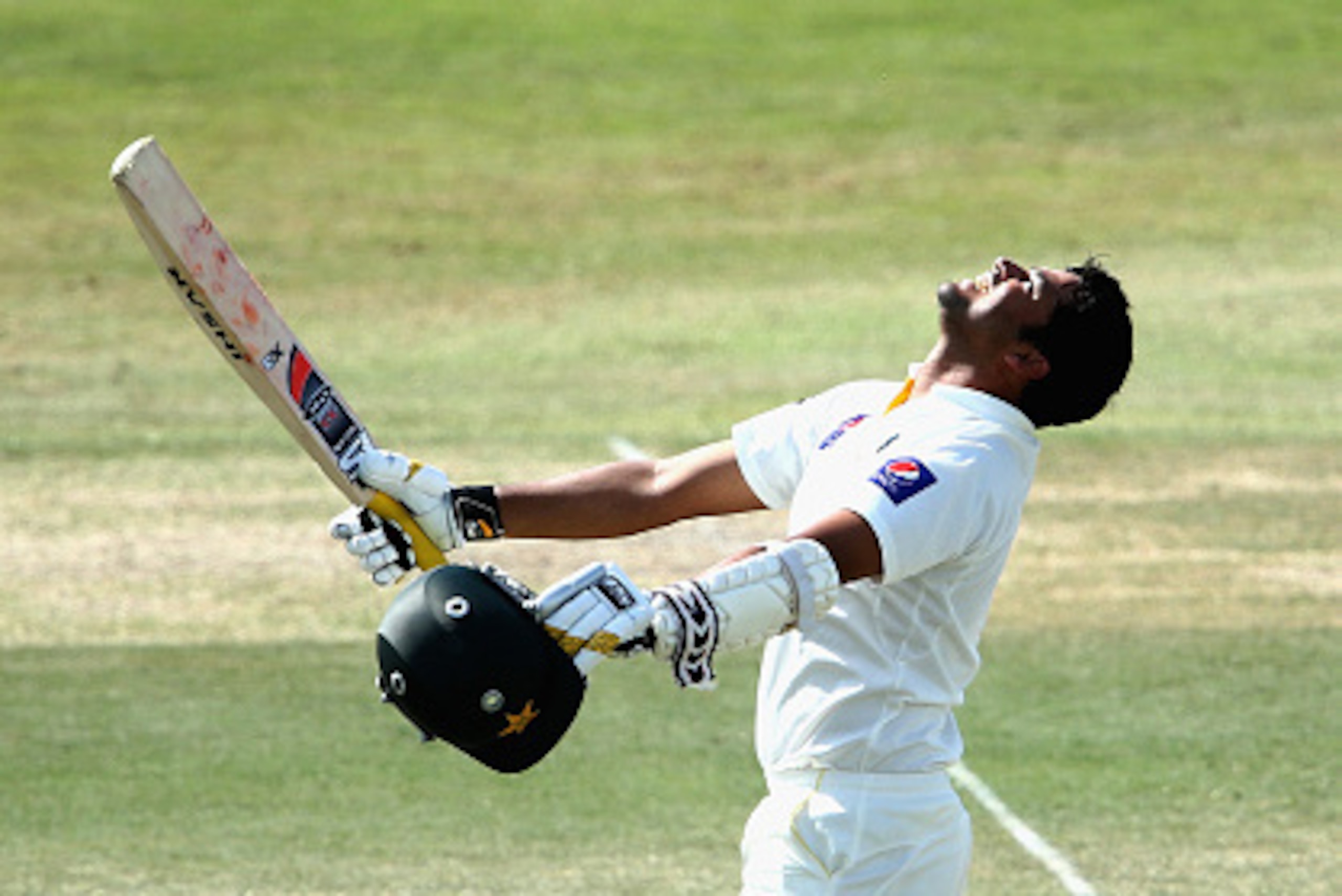 ABU DHABI, UNITED ARAB EMIRATES - NOVEMBER 02:  Azhar Ali of Pakistan celebrates reaching his century during Day Four of the Second Test between Pakistan and Australia at Sheikh Zayed Stadium on November 2, 2014 in Abu Dhabi, United Arab Emirates.  (Photo