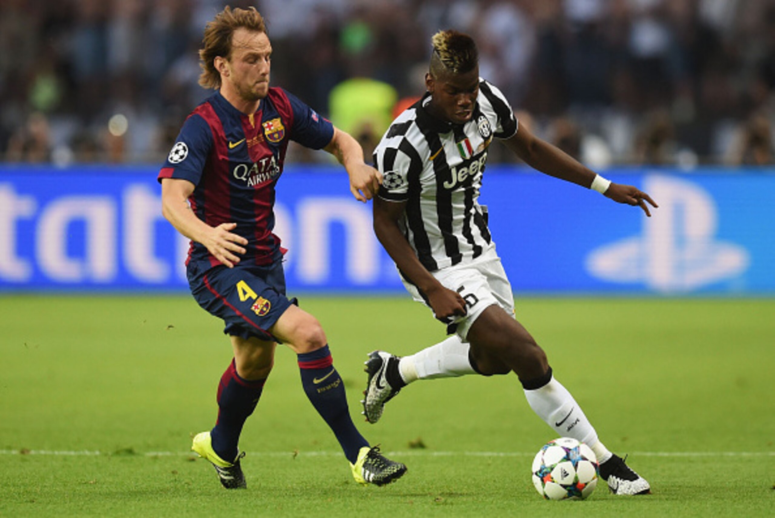 BERLIN, GERMANY - JUNE 06:  Paul Pogba of Juventus is tackled by Ivan Rakitic of Barcelona during the UEFA Champions League Final between Juventus and FC Barcelona at Olympiastadion on June 6, 2015 in Berlin, Germany.  (Photo by Matthias Hangst/Getty Imag