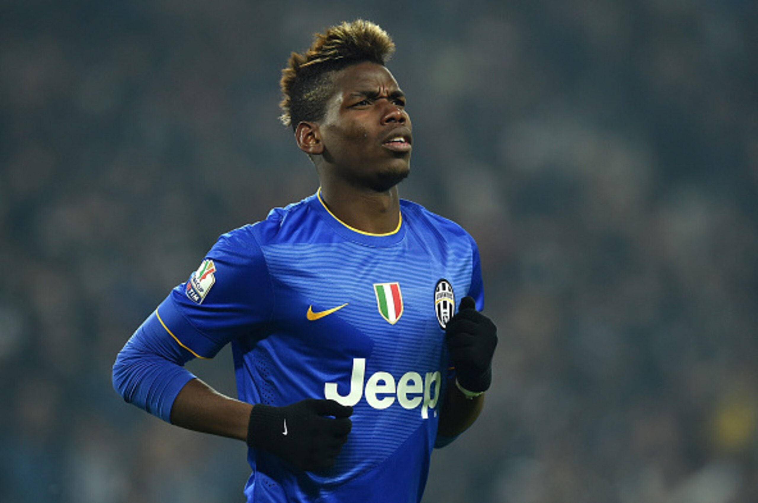 TURIN, ITALY - JANUARY 15:  Paul Pogba of Juventus FC celebrates a goal during the TIM Cup match between Juventus FC and Hellas Verona FC at Juventus Arena on January 15, 2015 in Turin, Italy.  (Photo by Valerio Pennicino/Getty Images)