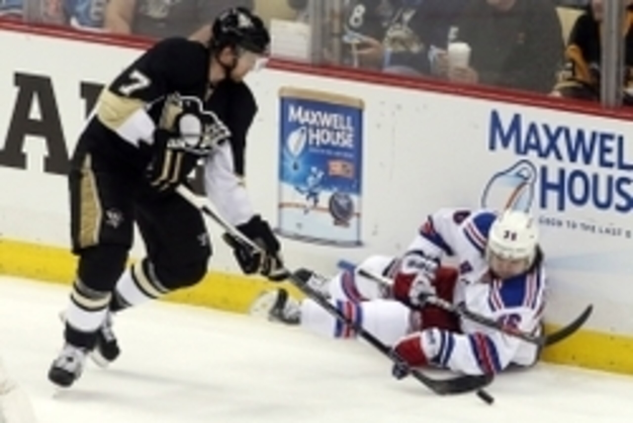 Apr 20, 2015; Pittsburgh, PA, USA; New York Rangers right wing Mats Zuccarello (36) plays the puck after being cross checked by Pittsburgh Penguins defenseman Paul Martin (7) during the second period in game three of the first round of the 2015 Stanley Cu
