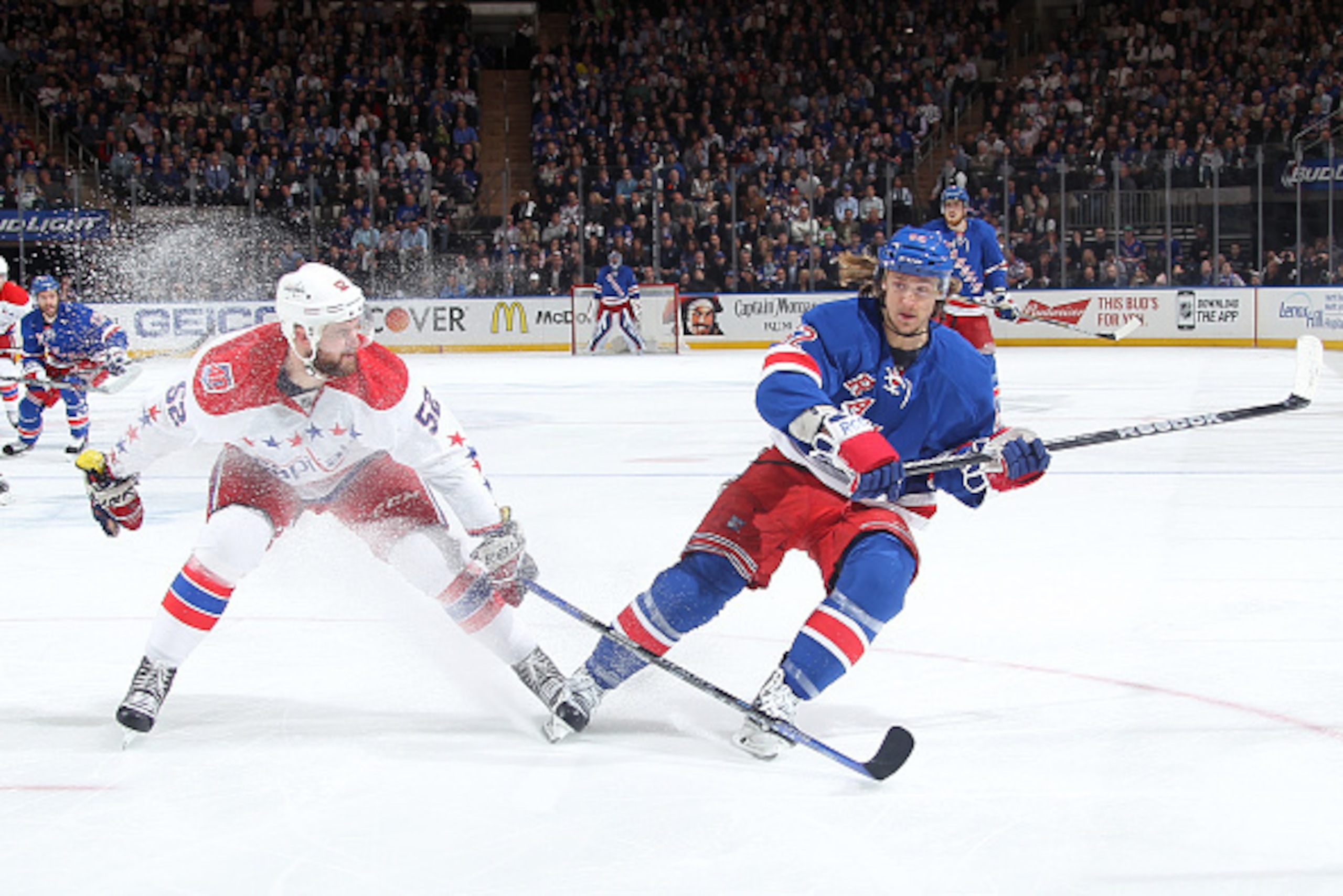 NEW YORK, NY - MAY 13:  Carl Hagelin #62 of the New York Rangers skates against Mike Green #52 of the Washington Capitals in Game Seven of the Eastern Conference Semifinals during the 2015 NHL Stanley Cup Playoffs at Madison Square Garden on May 13, 2015 