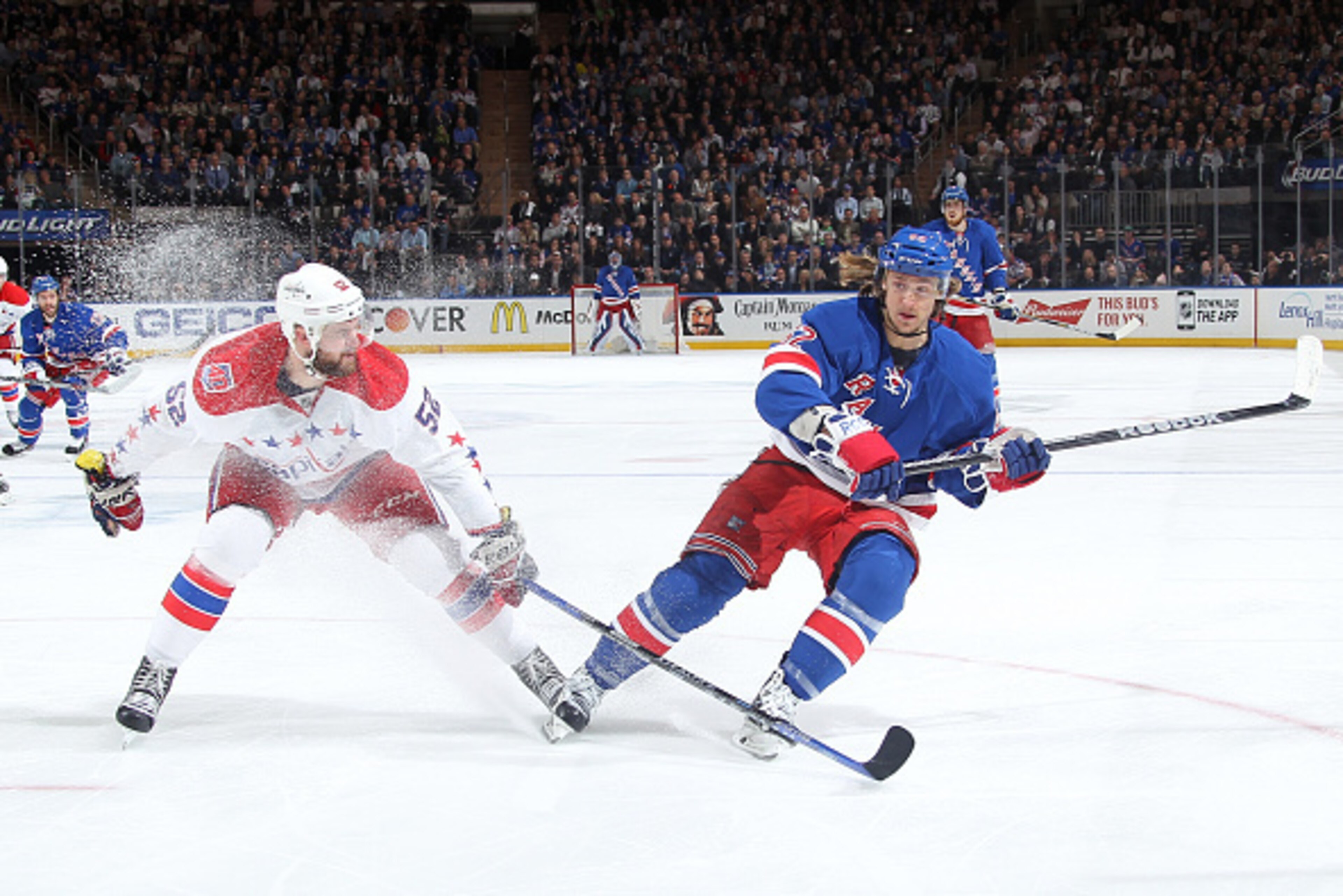 NEW YORK, NY - MAY 13:  Carl Hagelin #62 of the New York Rangers skates against Mike Green #52 of the Washington Capitals in Game Seven of the Eastern Conference Semifinals during the 2015 NHL Stanley Cup Playoffs at Madison Square Garden on May 13, 2015 