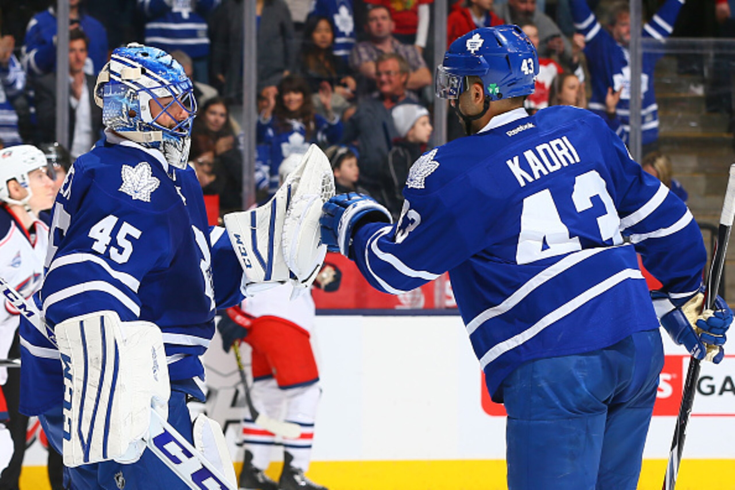 TORONTO, ON - JANUARY 9: Jonathan Bernier #45 and Nazem Kadri #43 of the Toronto Maple Leafs celebrate the win against the Columbus Blue Jackets during game action on January 9, 2015 at Air Canada Centre in Toronto, Ontario, Canada. (Photo by Graig Abel/N