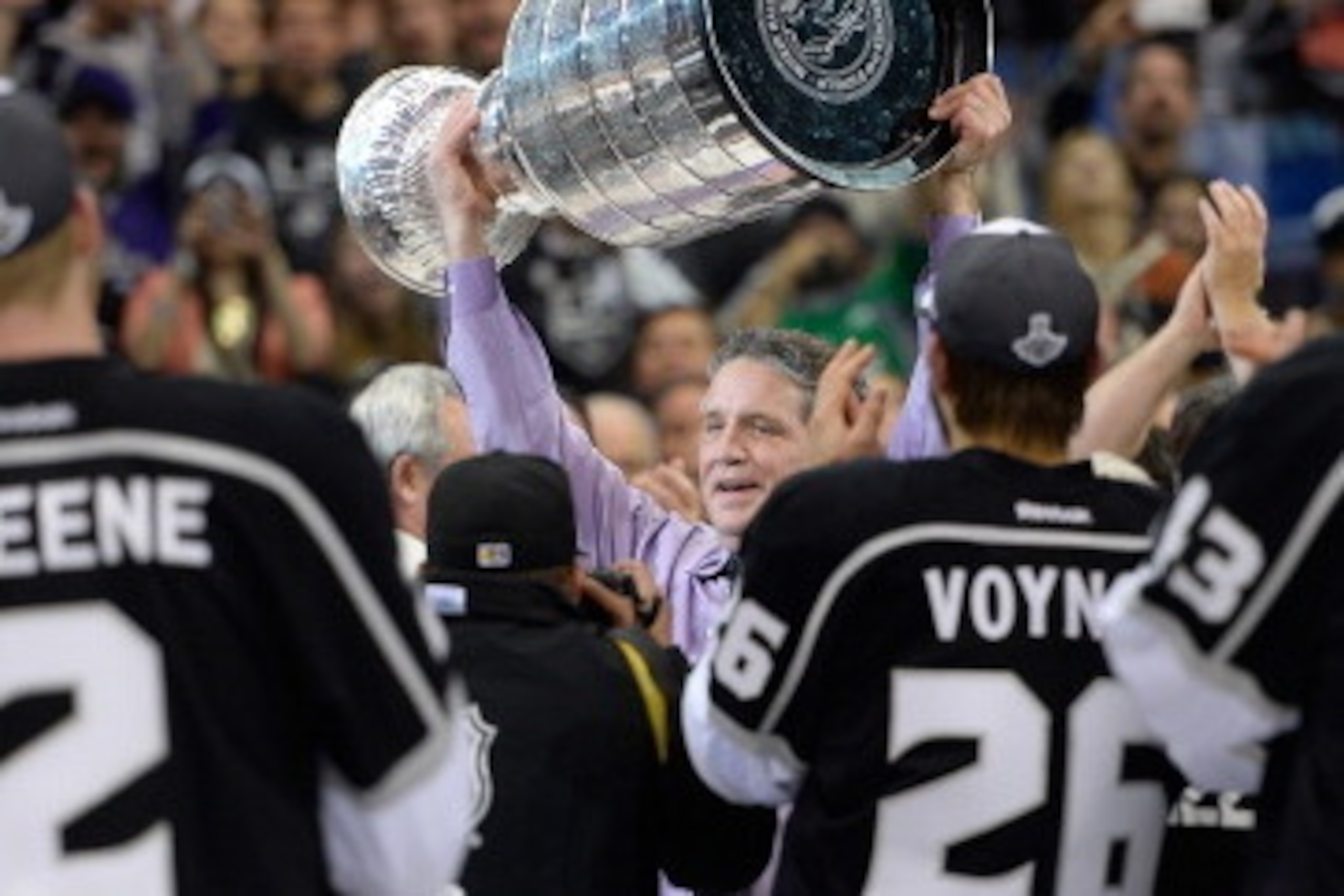 LOS ANGELES, CA - JUNE 13:   President, General Manager, and Alternate Governor Dean Lombardi of the Los Angeles Kings celebrates with the Stanley Cup after the Kings 3-2 double overtime victory against the New York Rangers in Game Five of the 2014 Stanle