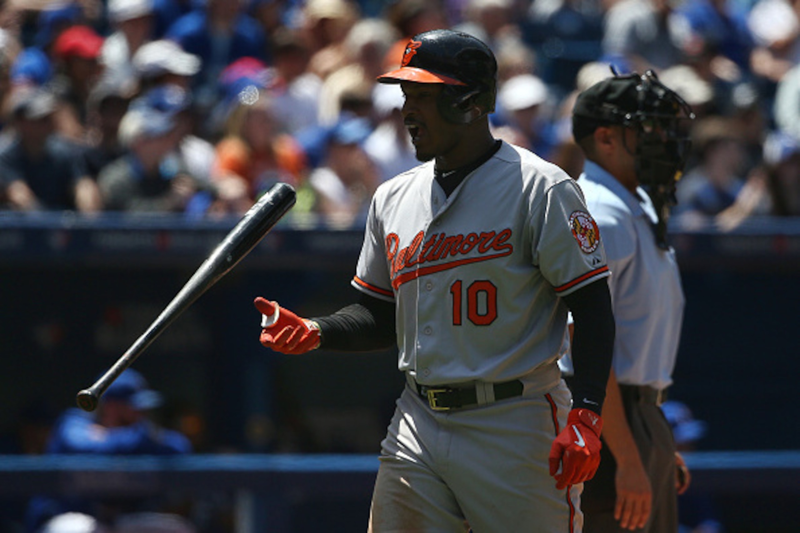 TORONTO, CANADA - JUNE 20: Adam Jones #10 of the Baltimore Orioles reacts after striking out in the fourth inning during MLB game action against the Toronto Blue Jays on June 20, 2015 at Rogers Centre in Toronto, Ontario, Canada. (Photo by Tom Szczerbowsk