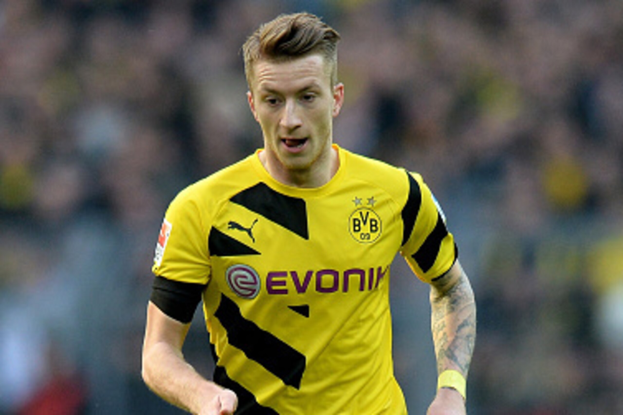 DORTMUND, GERMANY - APRIL 04: Marco Reus of Dortmund runs with the ball during the Bundesliga match between Borussia Dortmund and FC Bayern Muenchen at Signal Iduna Park on April 4, 2015 in Dortmund, Germany. (Photo by Sascha Steinbach/Getty Images For DORTMUND, GERMANY - APRIL 04: Marco Reus of Dortmund runs with the ball during the Bundesliga match between Borussia Dortmund and FC Bayern Muenchen at Signal Iduna Park on April 4, 2015 in Dortmund, Germany. (Photo by Sascha Steinbach/Getty Images For