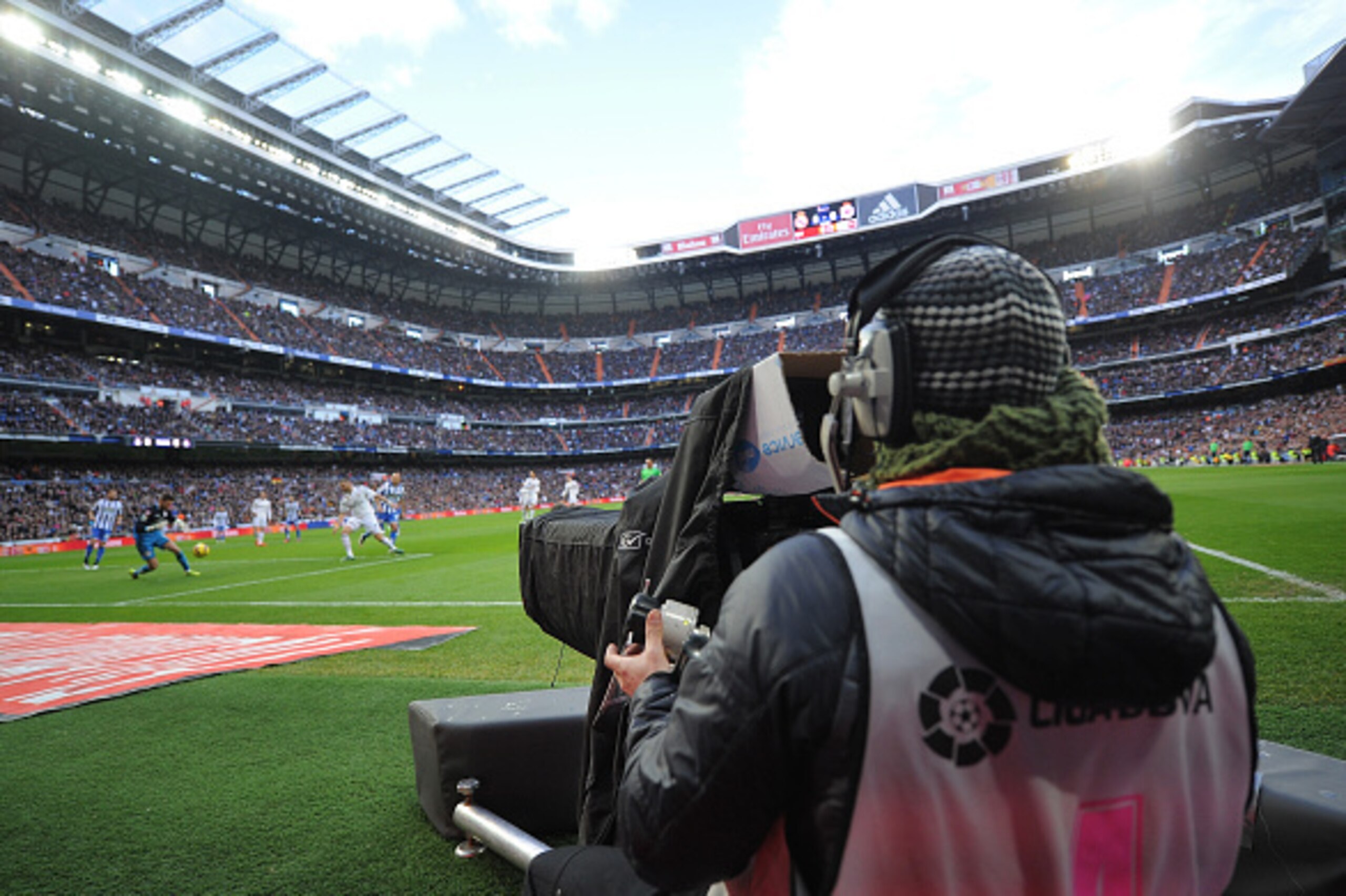 MADRID, SPAIN - FEBRUARY 15:  A Mediapro television cameraman films  the La Liga match between Real Madrid CF and RC Deportivo La Coruna at Estadio Santiago Bernabeu on February 15, 2015 in Madrid, Spain. La Liga clubs are threatening to go on strike if t