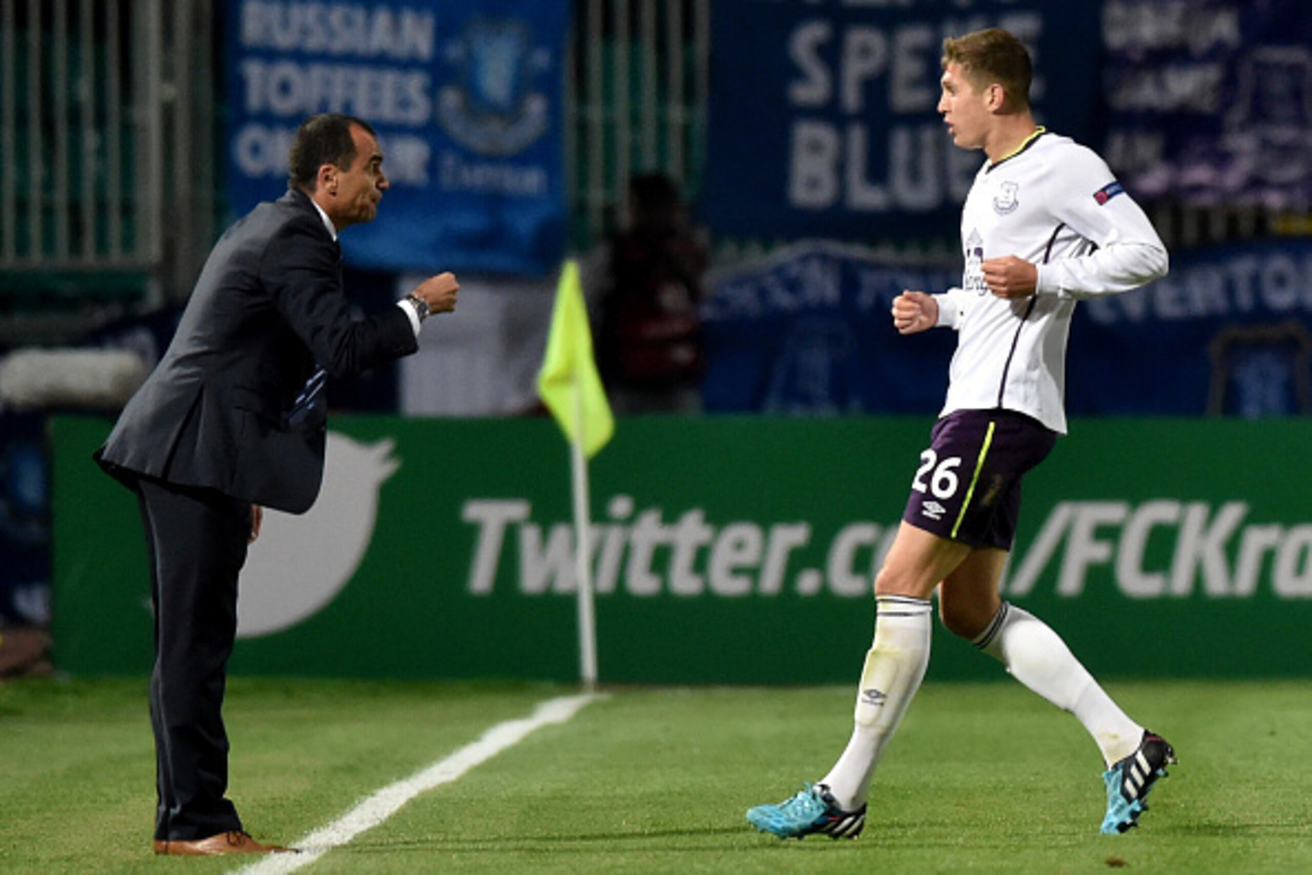 KRASNODAR,RUSSIA - OCTOBER 02:  Manager Roberto Martinez of Everton speaks to John Stones of Everton during the UEFA Europe League Group H match between Krasnodar and Everton at the Kuban Stadium on October 2, 2014 in Krasnodar,Russia. (Photo by Kirill Ku