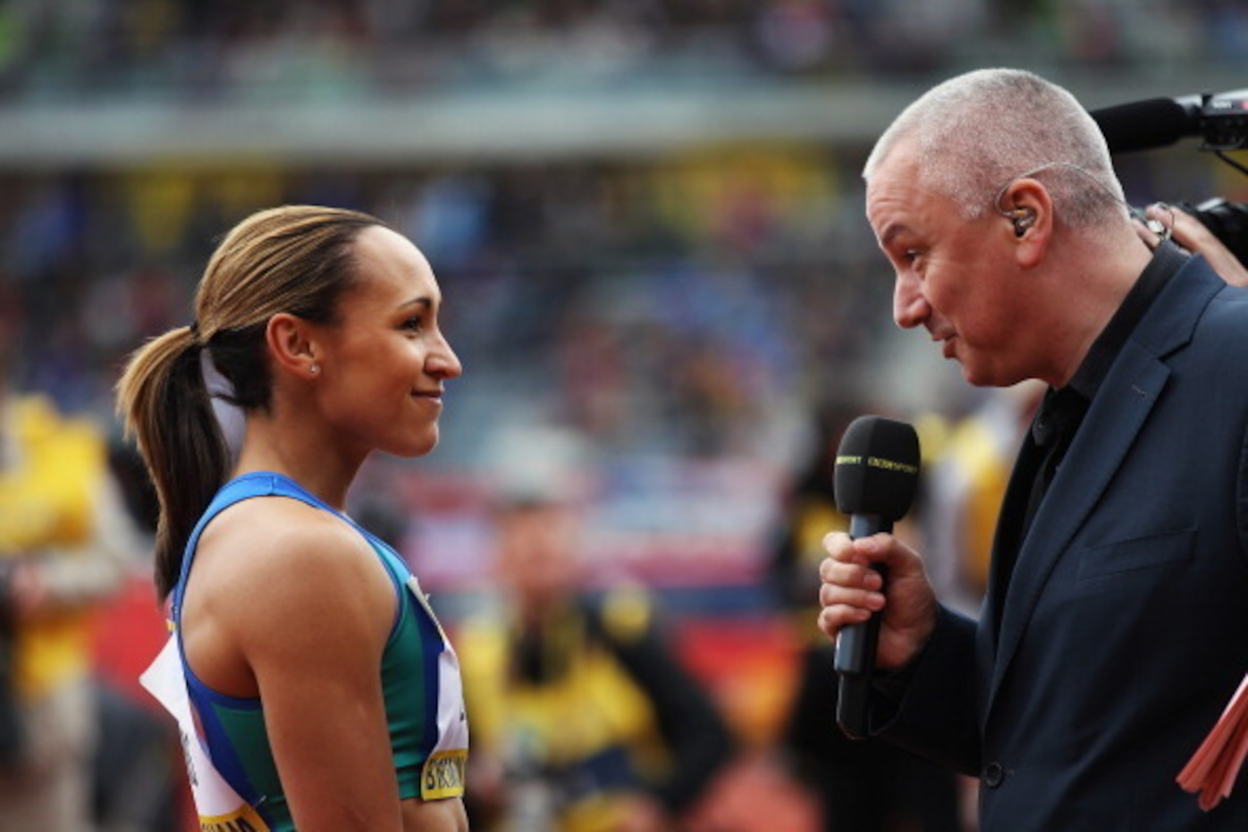 BIRMINGHAM, ENGLAND - JUNE 23:  Jessica Ennis of Great Britain chats Phil Jones of the BBC during the AVIVA 2012 Trials at Alexander Stadium on June 23, 2012 in Birmingham, England.  (Photo by Bryn Lennon/Getty Images for Aviva). Search Aviva Athletics on