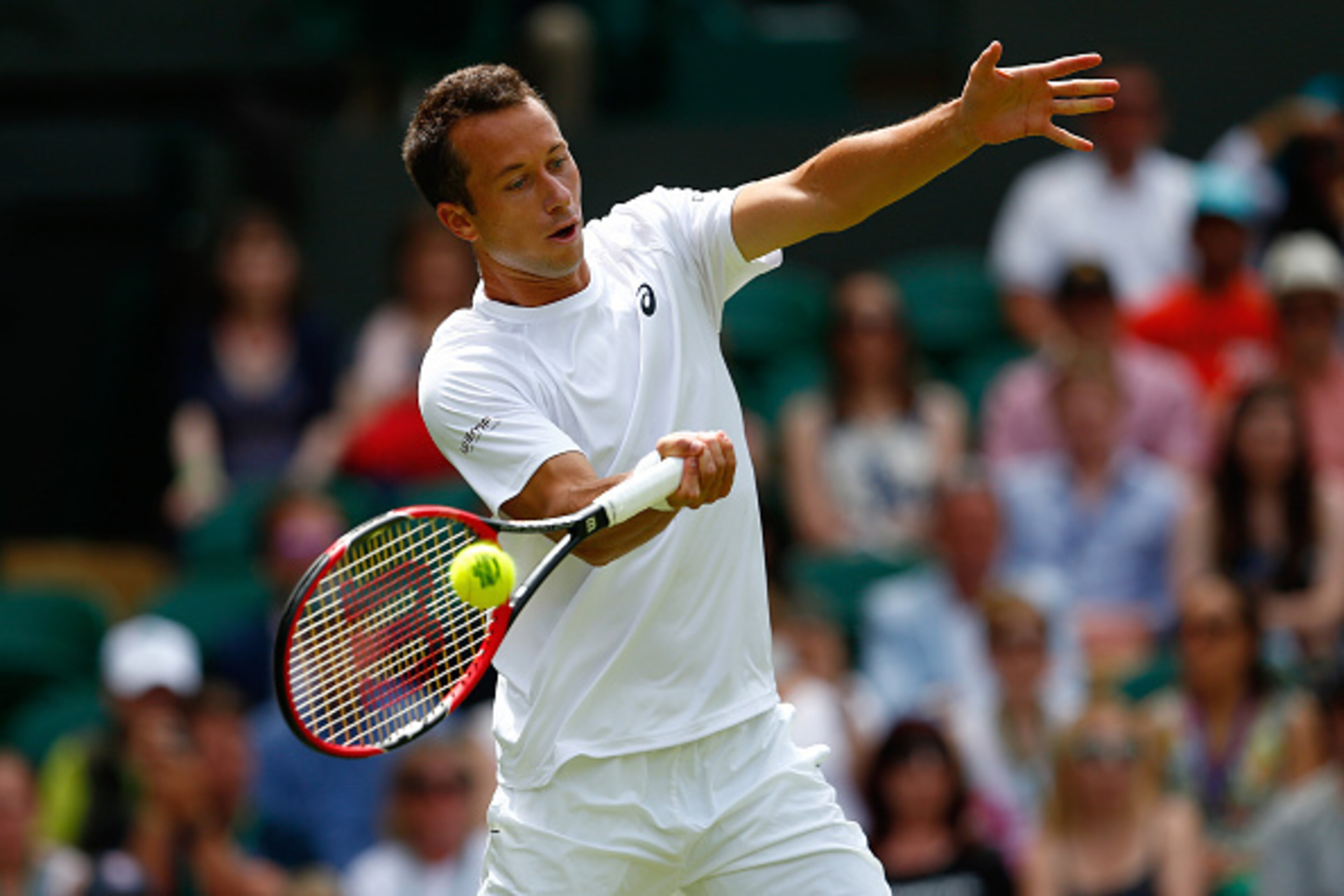 LONDON, ENGLAND - JUNE 29: Philipp Kohlschreiber of Germany plays a forehand against Novak Djokovic of Serbia in their GentlemenÂs Singles first round match during day one of the Wimbledon Lawn Tennis Championships at the All England Lawn Tennis and Croqu