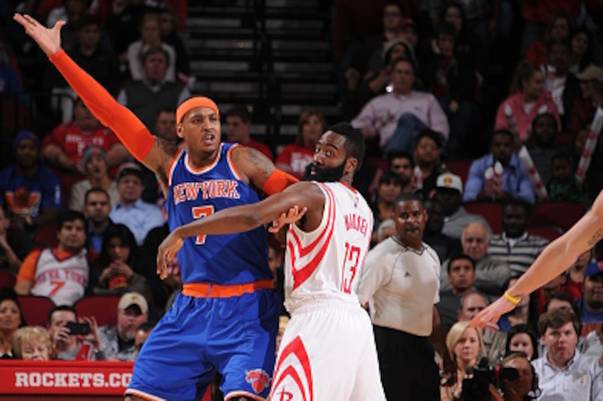 HOUSTON, TX - NOVEMBER 24:  Carmelo Anthony #7 of the New York Knicks posts up against James Harden #13 of the Houston Rockets during the game on November 24, 2014 at the Toyota Center in Houston, Texas. NOTE TO USER: User expressly acknowledges and agree