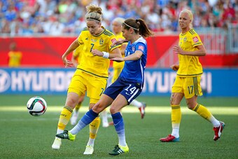 WINNIPEG, MB - JUNE 12:  Morgan Brian #14 of the United States and Lisa Dahlkvist #7 of Sweden go for the ball in the first half in the FIFA Women's World Cup Canada 2015 match at Winnipeg Stadium on June 12, 2015 in Winnipeg, Canada.  (Photo by Kevin C. 