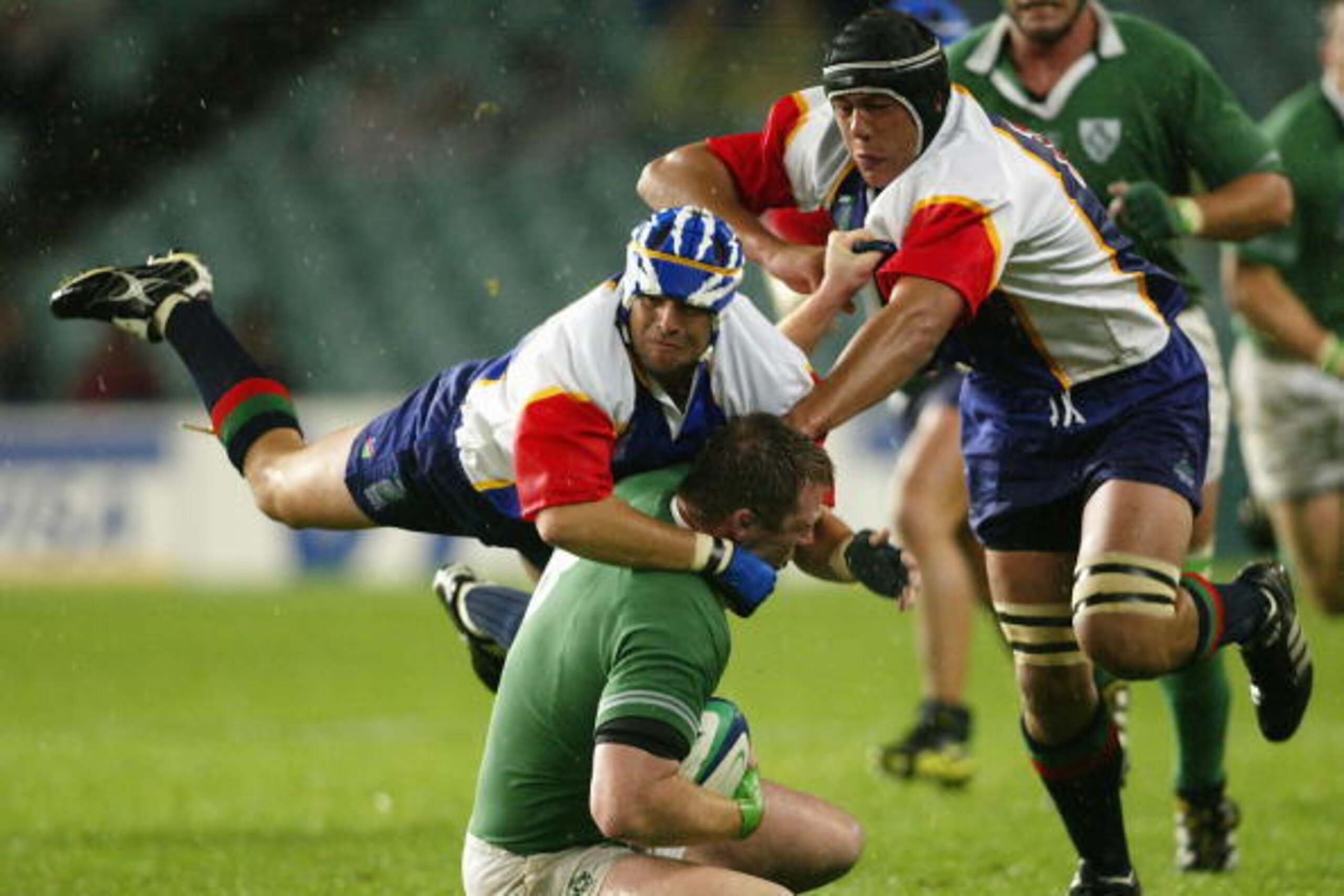 SYDNEY, AUSTRALIA - OCTOBER 19:  Morne Schreuder of Namibia tackles Eric Miller of Ireland during the Rugby World Cup Pool A match between Ireland and Namibia at Aussie Stadium October 19, 2003 in Sydney, Australia. (Photo by Daniel Berehulak/Getty Images