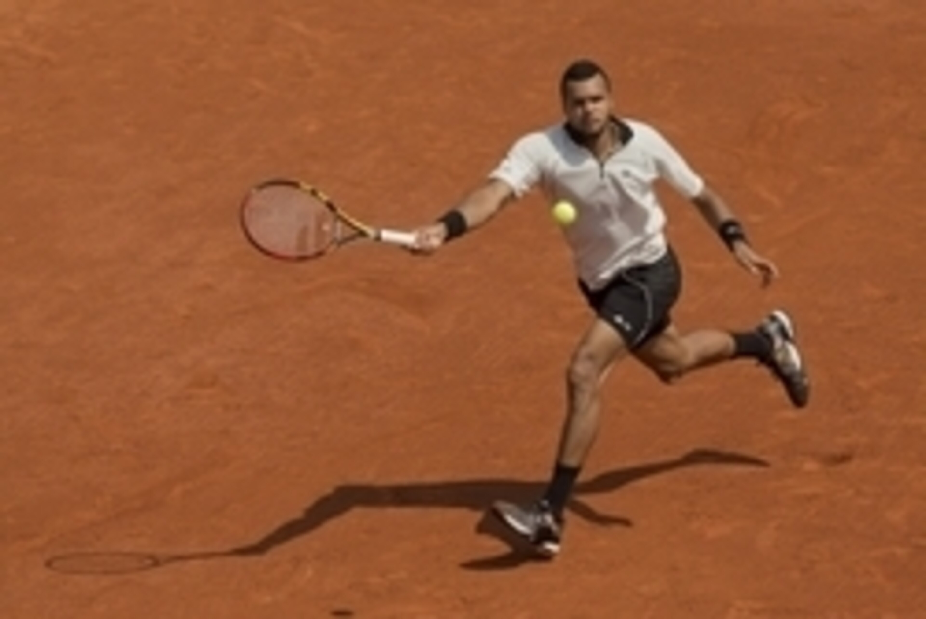 Jun 5, 2015; Paris, France; Jo-Wilfried Tsonga (FRA) in action during his match against Stanislas Wawrinka (SUI) on day 13 of the 2015 French Open at Roland Garros.  Mandatory Credit: Susan Mullane-USA TODAY Sports