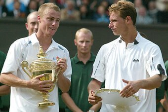 Lleyton Hewitt holds the winning trophy after defeating David Nalbandian for the 2002 Wimbledon title.