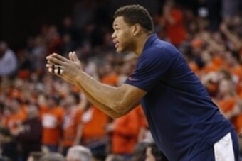 Feb 28, 2015; Charlottesville, VA, USA; Injured Virginia Cavaliers guard Justin Anderson cheers from the bench against the Virginia Tech Hokies in the first half at John Paul Jones Arena. The Cavaliers won 69-57. Mandatory Credit: Geoff Burke-USA TODAY Sp