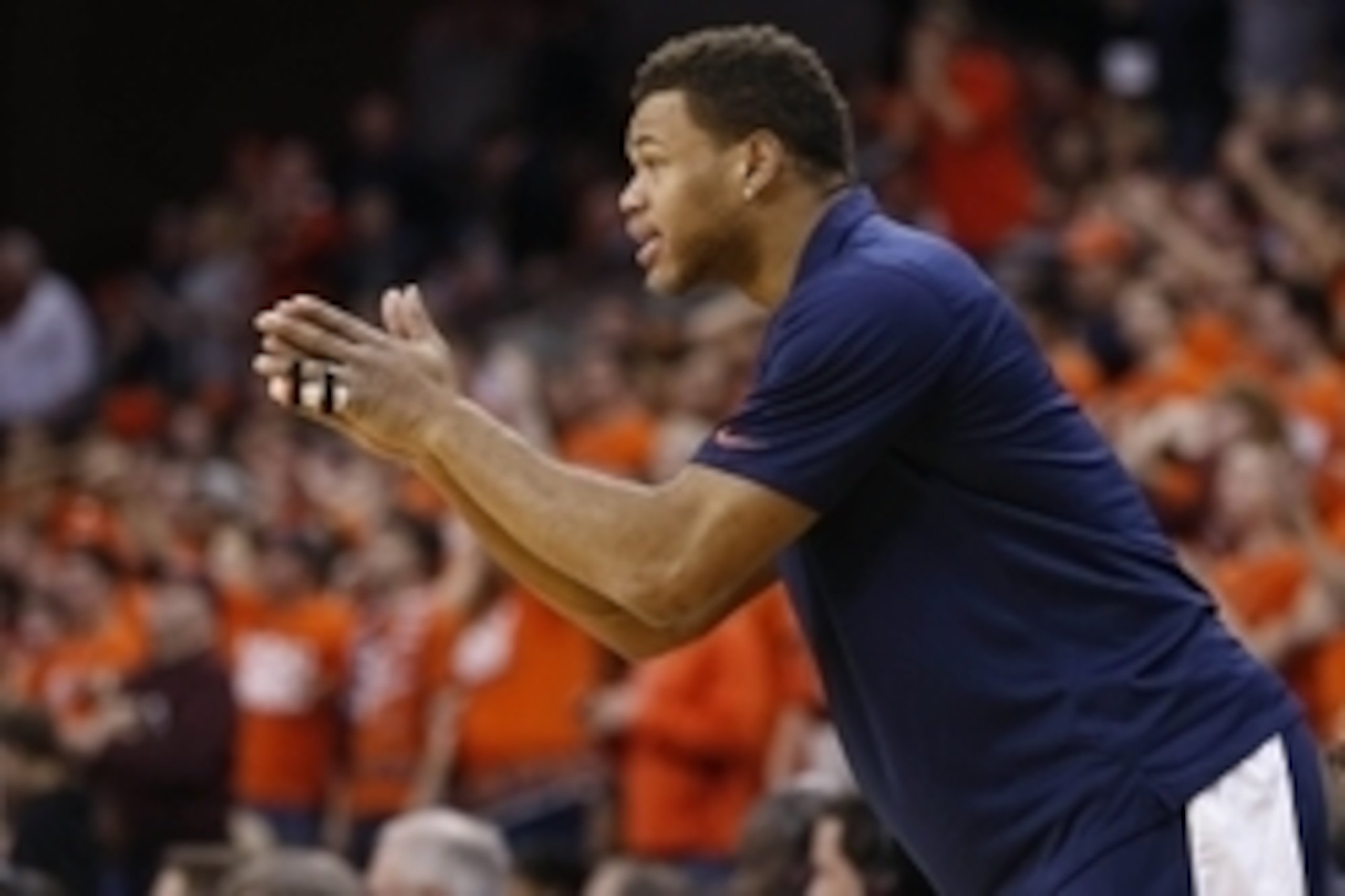 Feb 28, 2015; Charlottesville, VA, USA; Injured Virginia Cavaliers guard Justin Anderson cheers from the bench against the Virginia Tech Hokies in the first half at John Paul Jones Arena. The Cavaliers won 69-57. Mandatory Credit: Geoff Burke-USA TODAY Sp