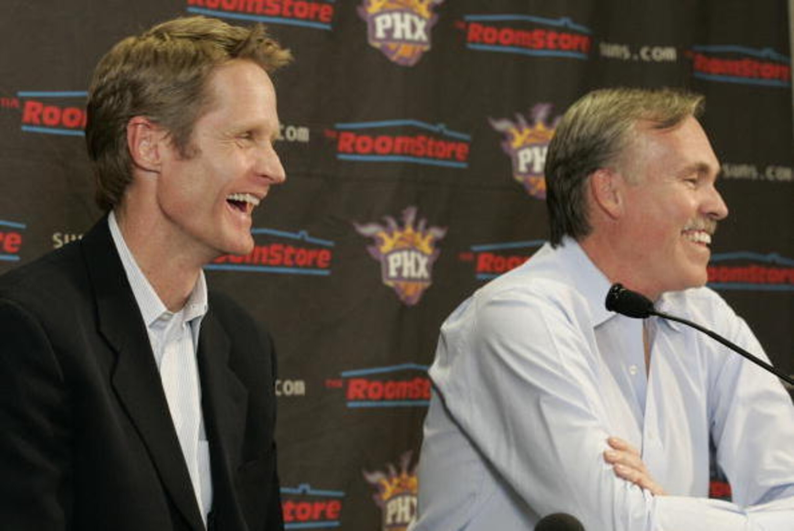 PHOENIX - FEBRUARY 6:  Phoenix Suns General Manager Steve Kerr and Head Coach Mike D'Antoni (R) speak in a pregame interview in regards to the Suns' acquisition of Shaquille O'Neal before Suns host New Orleans Hornets in an NBA game played at U.S. Airways