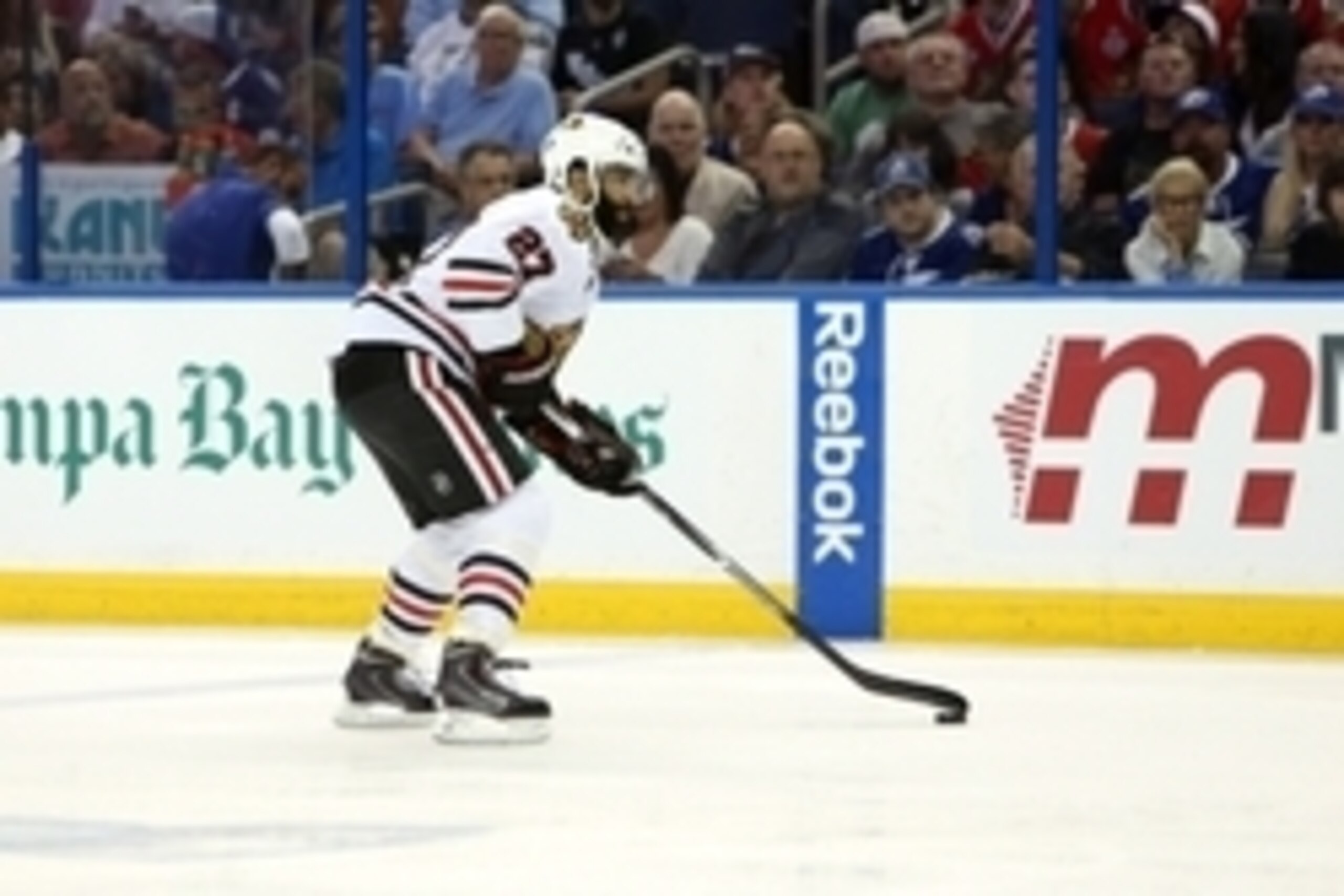 Jun 13, 2015; Tampa, FL, USA; Chicago Blackhawks defenseman Johnny Oduya (27) skates with the puck during the first period at game five of the 2015 Stanley Cup Final at Amalie Arena. Mandatory Credit: Kim Klement-USA TODAY Sports