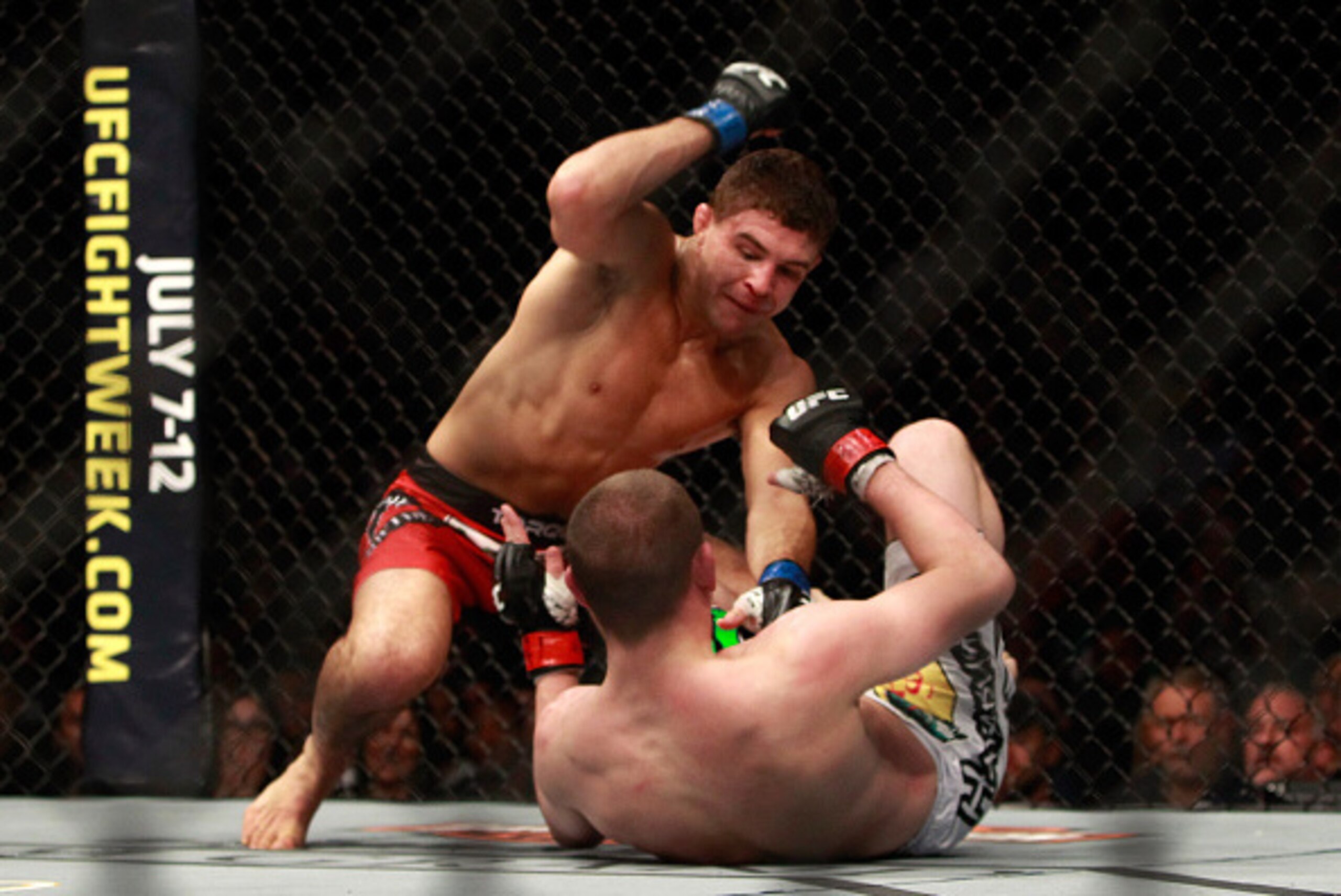LAS VEGAS, NV - JANUARY 31:  Al Iaquinta (L) pounds on Joe Lauzon in a lightweight bout during UFC 183 at the MGM Grand Garden Arena on January 31, 2015 in Las Vegas, Nevada. Iaquinta won with a second-round TKO.  (Photo by Steve Marcus/Getty Images)
