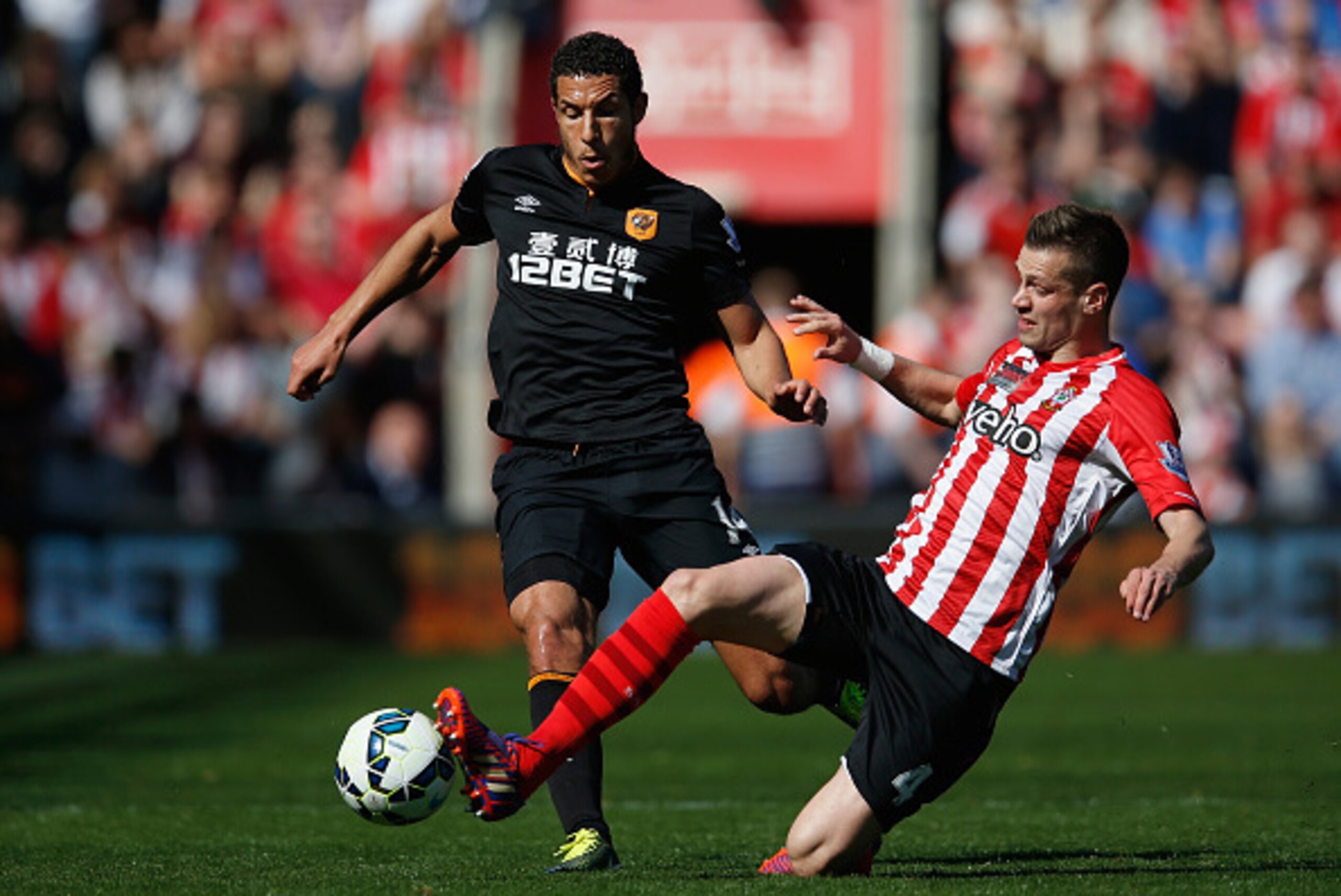 SOUTHAMPTON, ENGLAND - APRIL 11:  Morgan Schneiderlin of Southampton tackles Jake Livermore of Hull City during the Barclays Premier League match between Southampton and Hull City at St Mary's Stadium on April 11, 2015 in Southampton, England.  (Photo by 