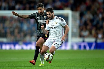 MADRID, SPAIN - APRIL 18: Francisco Roman Alarcon alias Isco (R) of Real Madrid CF competes for the ball with Samuel Garcia Snachez (L) of Malaga CF during the La Liga match between Real Madrid CF and Malaga CF at Estadio Santiago Bernabeu on April 18, 20