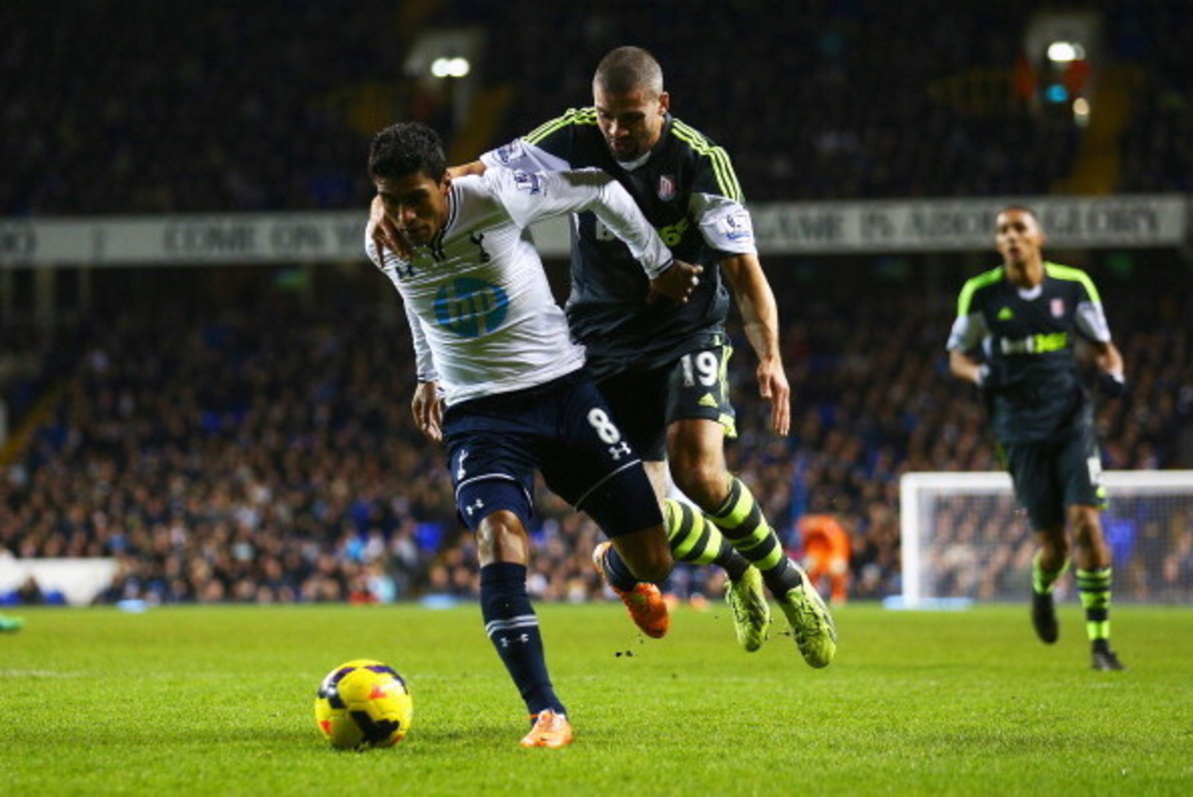 LONDON, ENGLAND - DECEMBER 29: Paulinho of Tottenham Hotspur is challenged by Jonathan Walters of Stoke City during the Barclays Premier League match between Tottenham Hotspur and Stoke City at White Hart Lane on December 29, 2013 in London, England. (P LONDON, ENGLAND - DECEMBER 29: Paulinho of Tottenham Hotspur is challenged by Jonathan Walters of Stoke City during the Barclays Premier League match between Tottenham Hotspur and Stoke City at White Hart Lane on December 29, 2013 in London, England. (P