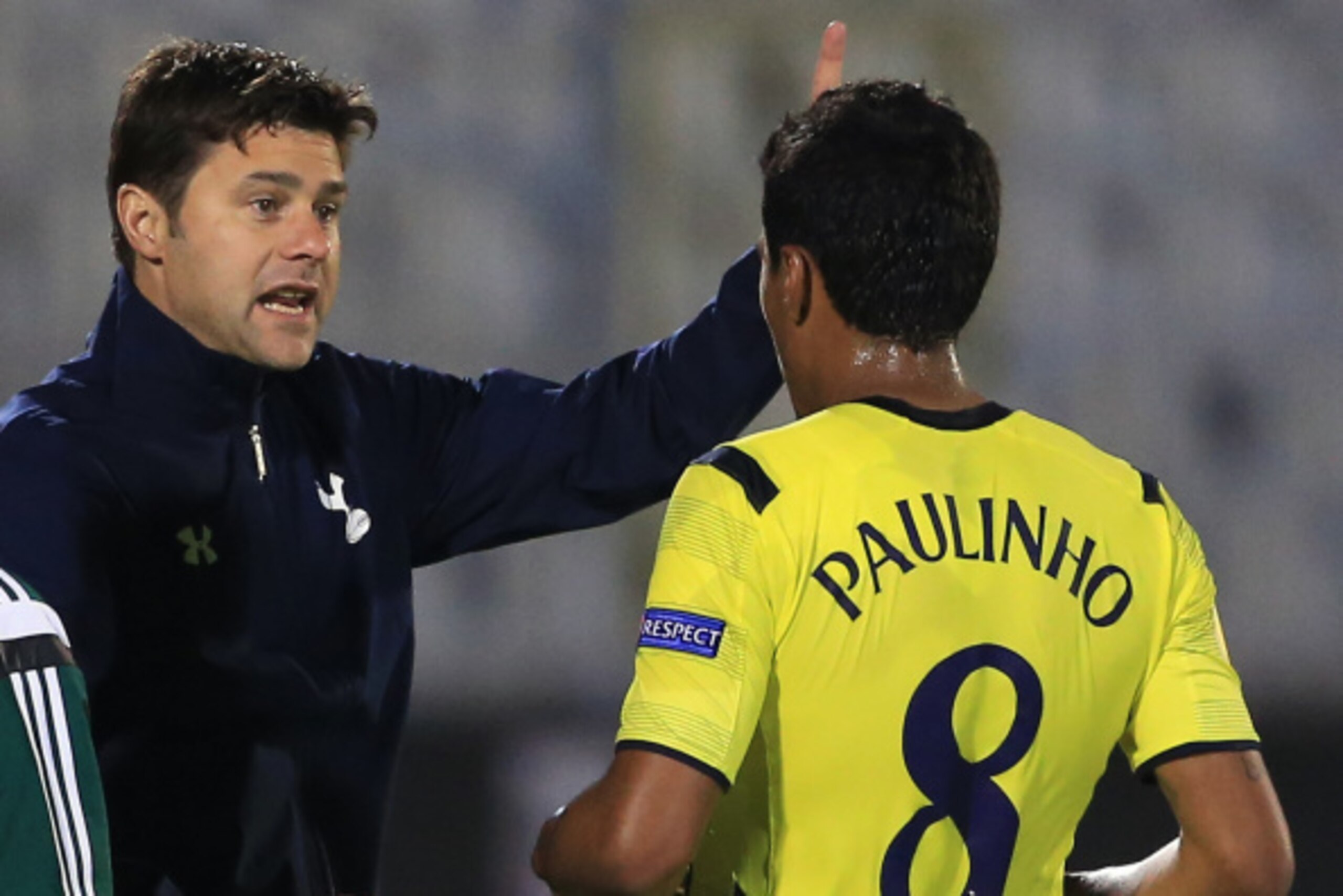 BELGRADE, SERBIA - SEPTEMBER 18: Head coach Mauricio Pochettino (L) of Tottenham Hotspur give instructions to Paulinho (R) during the UEFA Europa League match between Partizan and Tottenham Hotspur at the Stadium JNA on September 18, 2014 in Belgrade, Ser