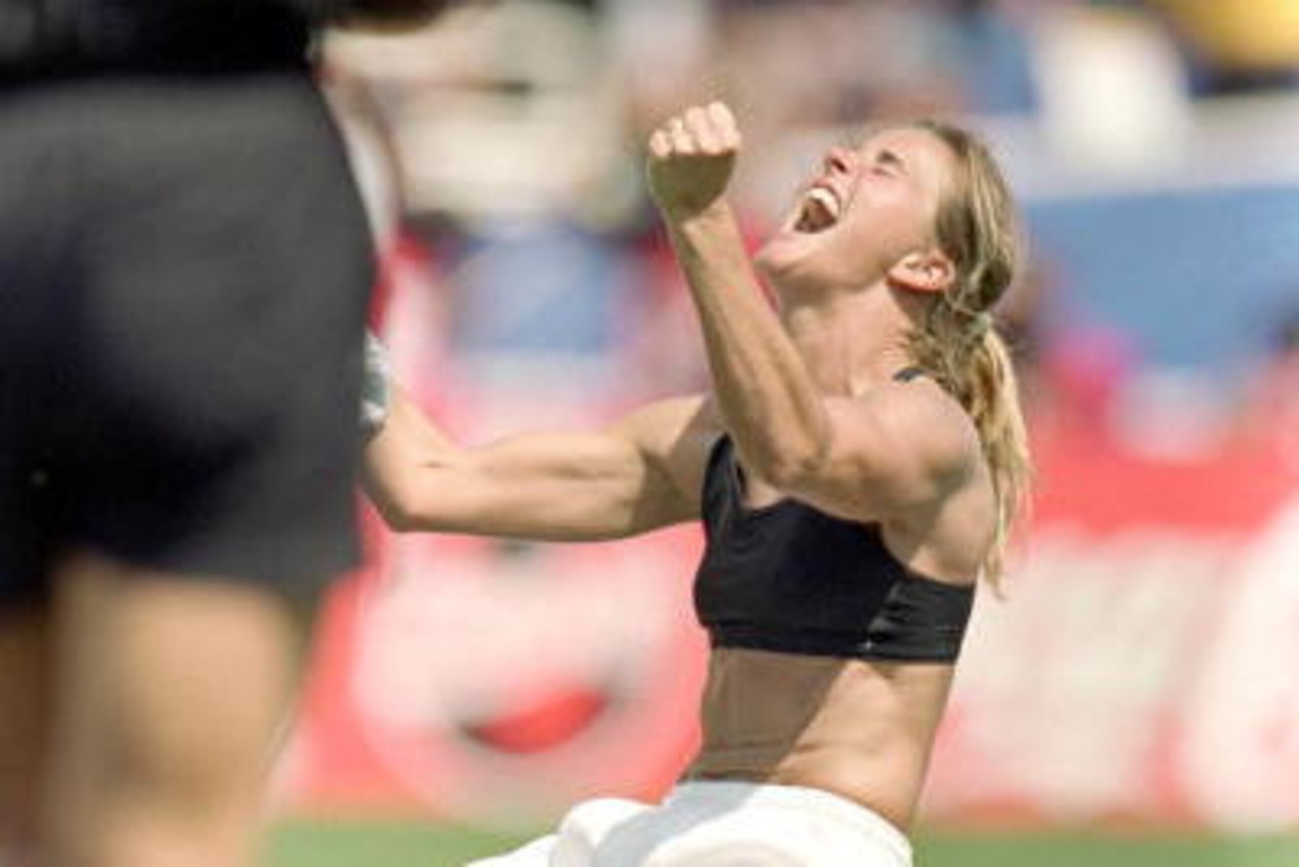 PASADENA, CA - JULY 10:  Brandi Chastain of Team USA celebrates during the Women's World Cup against Team China at The Rose Bowl on July 10, 1999 in Pasadena, California. Team USA won 5-4. (Photo by Jed Jacobsohn/Getty Images)
