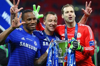 LONDON, ENGLAND - MARCH 01: (L-R) Diego Costa, John Terry and Petr Cech of Chelsea pose with the trophy after the Capital One Cup Final match between Chelsea and Tottenham Hotspur at Wembley Stadium on March 1, 2015 in London, England.  (Photo by Clive Ma