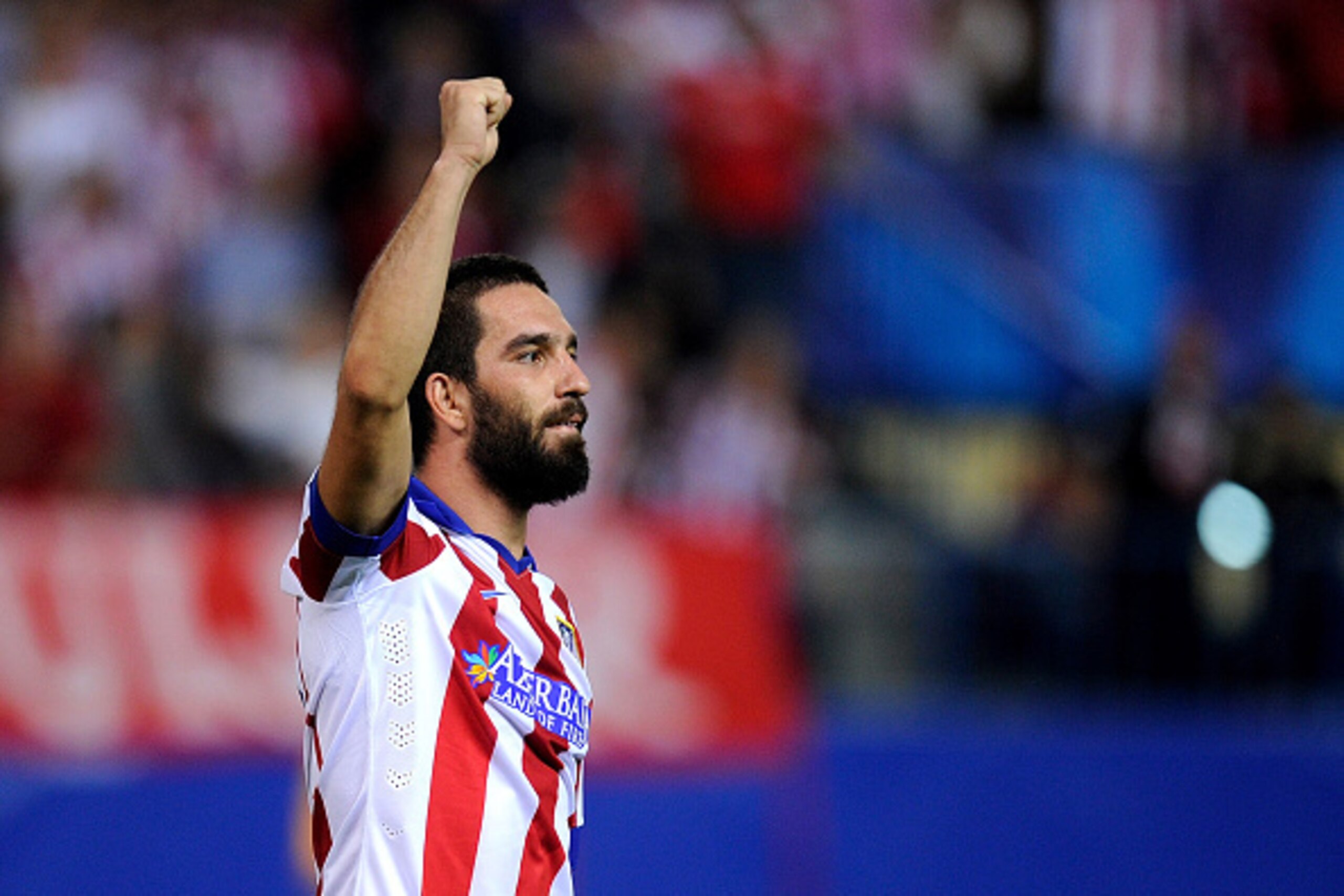 MADRID, SPAIN - OCTOBER 01:  Arda Turan of Club Atletico de Madrid celebrates after scoring his team's opening goal during the UEFA Champions League Group A match between Club Atletico de Madrid and Juventus at Vicente Calderon Stadium on October 1, 2014 