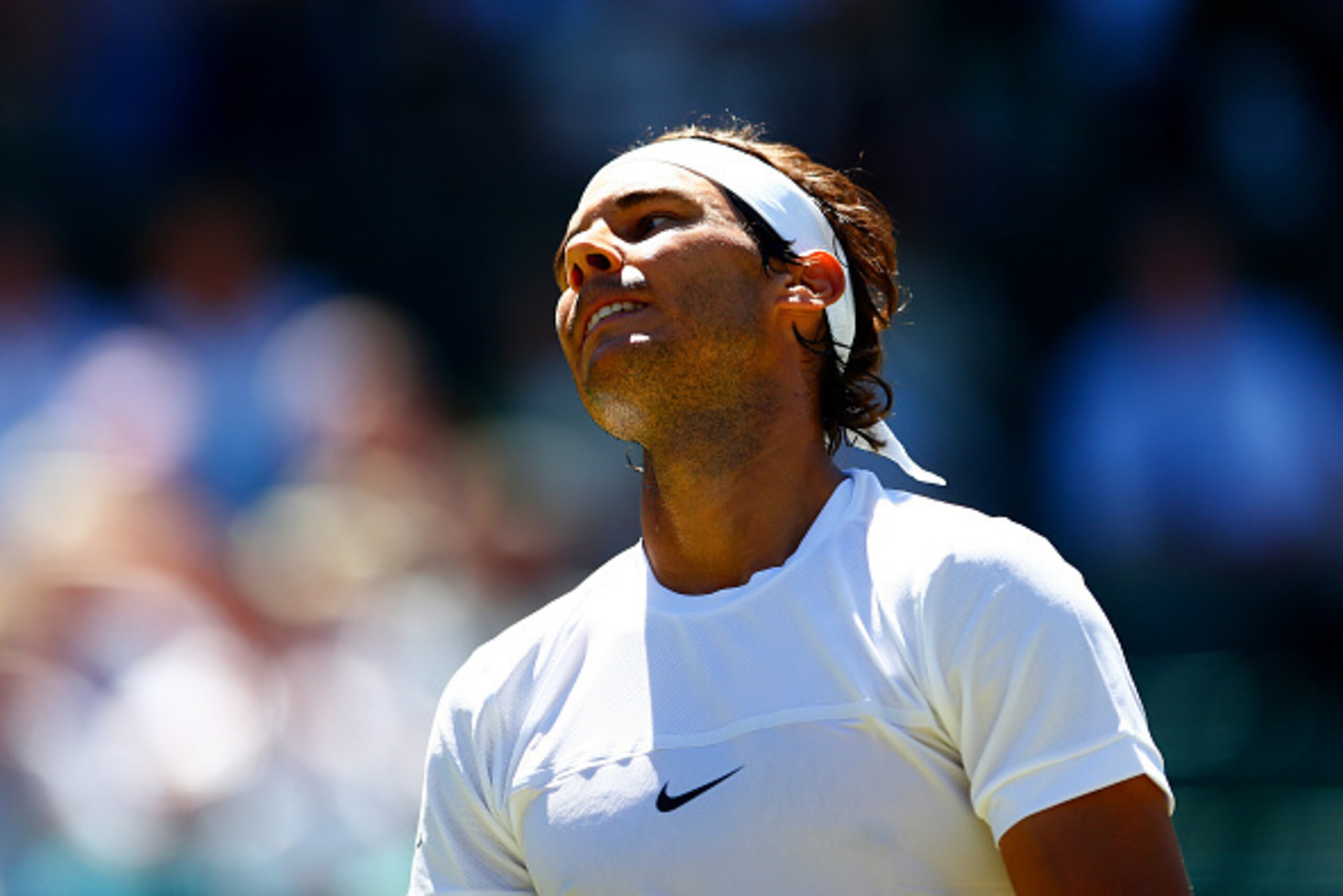 LONDON, ENGLAND - JUNE 30:  Rafael Nadal of Spain reacts in his Gentlemens Singles first round match against Thomaz Bellucci of Brazil during day two of the Wimbledon Lawn Tennis Championships at the All England Lawn Tennis and Croquet Club on June 30, 20