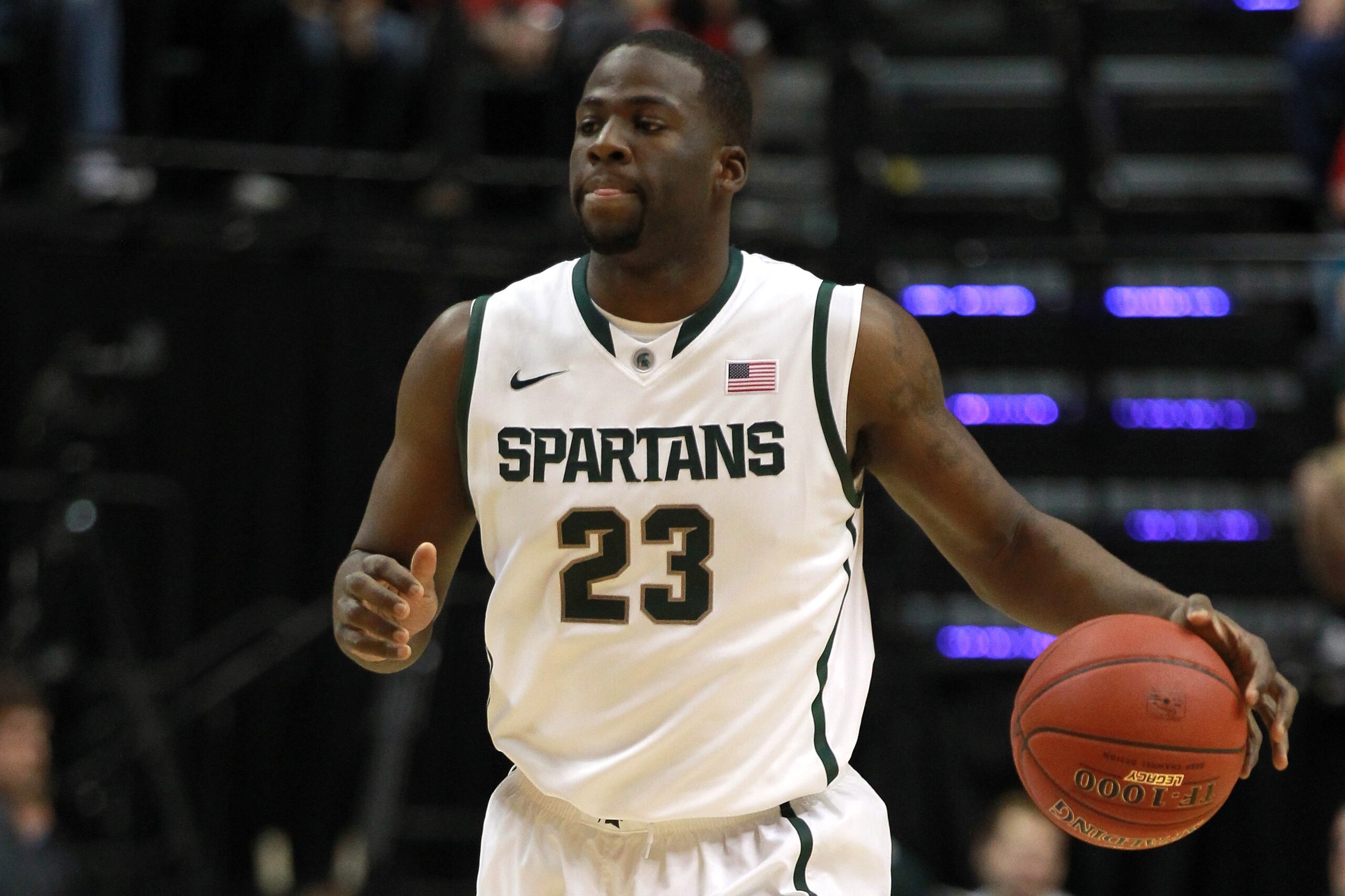 INDIANAPOLIS, IN - MARCH 11:  Draymond Green #23 of the Michigan State Spartans brings the ball up court against the Ohio State Buckeyes during the Final Game of the 2012 Big Ten Men's Conference Basketball Tournament at Bankers Life Fieldhouse on March 1