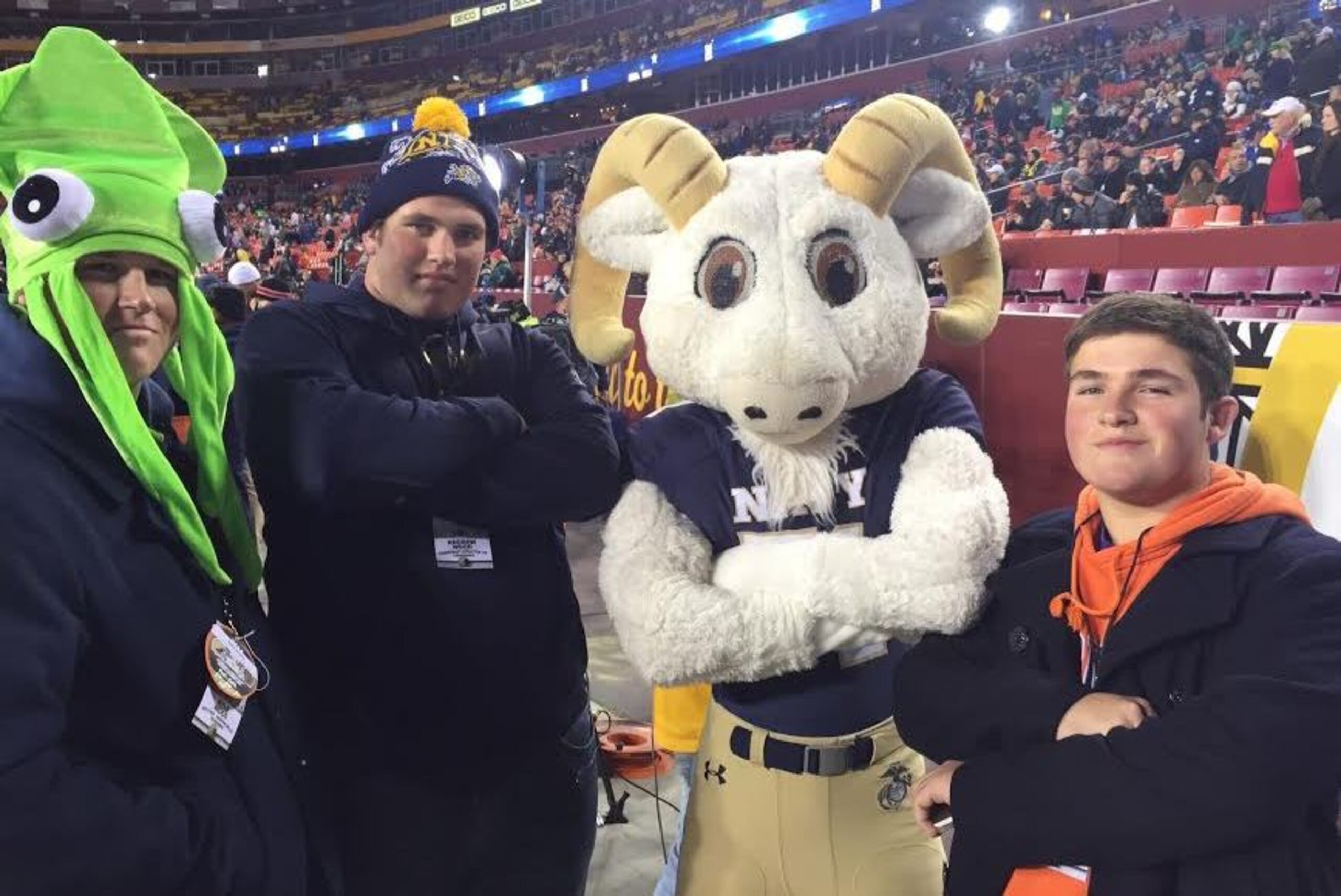 Andrew, second from left, poses with brothers Kyle, far left, and Coleton, and Navy mascot "Bill the Goat." Andrew, second from left, poses with brothers Kyle, far left, and Coleton, and Navy mascot "Bill the Goat."