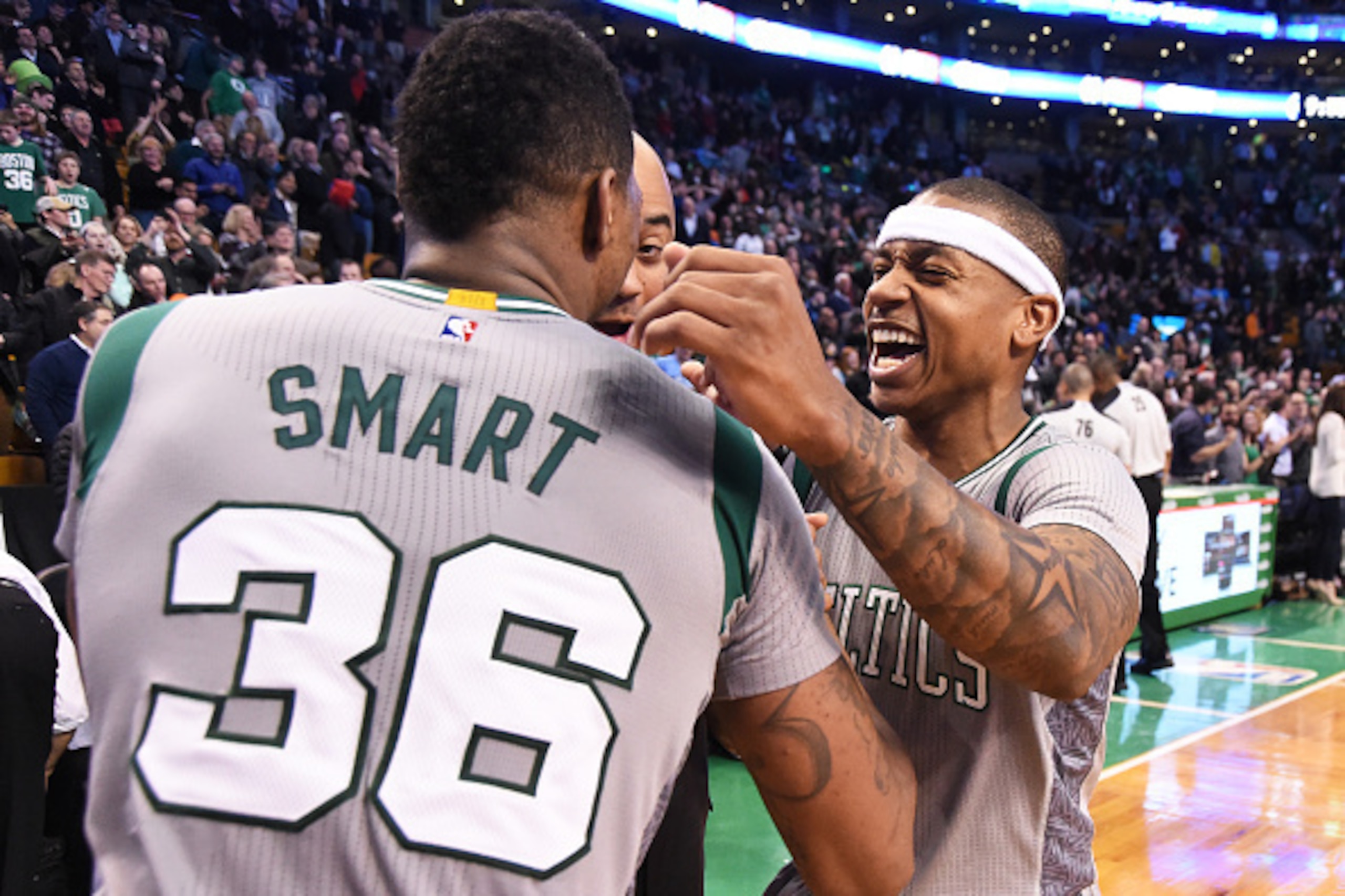 BOSTON, MA - MARCH 4:  Marcus Smart #36 and Isaiah Thomas #4 of the Boston Celtics celebrates after winning in the final second of the game against the Utah Jazz on March 4, 2015 at TD Garden in Boston, Massachusetts.  NOTE TO USER: User expressly acknowl