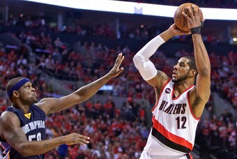 Apr 27, 2015; Portland, OR, USA; Portland Trail Blazers forward LaMarcus Aldridge (12) shoots over Memphis Grizzlies forward Zach Randolph (50) during the second quarter in game four of the first round of the NBA Playoffs at the Moda Center. Mandatory Cre