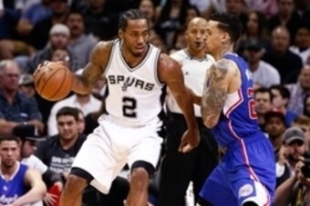Apr 30, 2015; San Antonio, TX, USA; San Antonio Spurs small forward Kawhi Leonard (2) drives against Los Angeles Clippers small forward Matt Barnes (22) in game six of the first round of the NBA Playoffs at AT&T Center. Mandatory Credit: Soobum Im-USA TOD