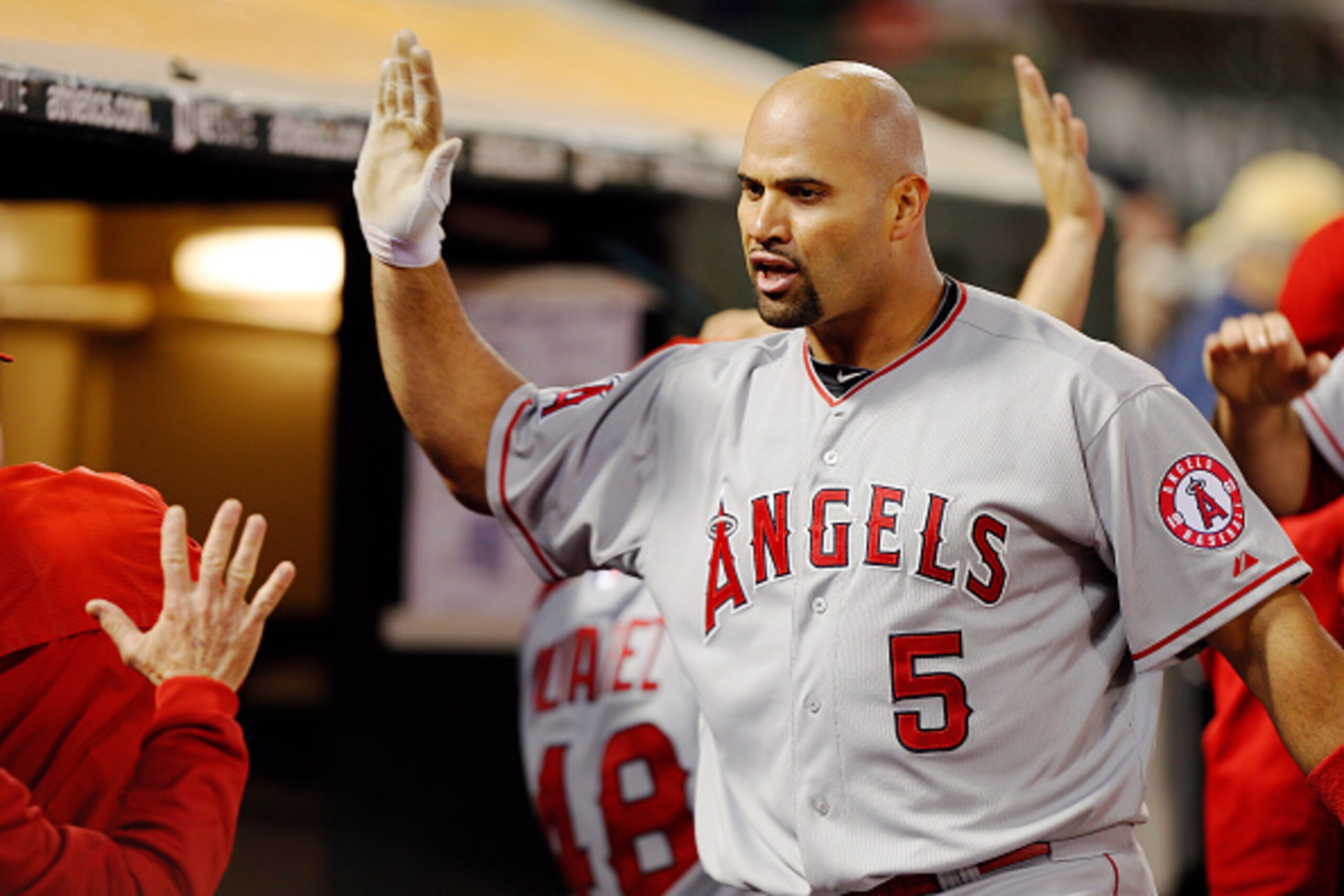 OAKLAND, CA - JUNE 19: Albert Pujols #5 of the Los Angeles Angels of Anaheim celebrates a grand slam against the Oakland Athletics in the seventh inning to take a 9-7 lead at O.co Coliseum on June 19, 2015 in Oakland, California. The Angels won 12-7. ( OAKLAND, CA - JUNE 19: Albert Pujols #5 of the Los Angeles Angels of Anaheim celebrates a grand slam against the Oakland Athletics in the seventh inning to take a 9-7 lead at O.co Coliseum on June 19, 2015 in Oakland, California. The Angels won 12-7. (