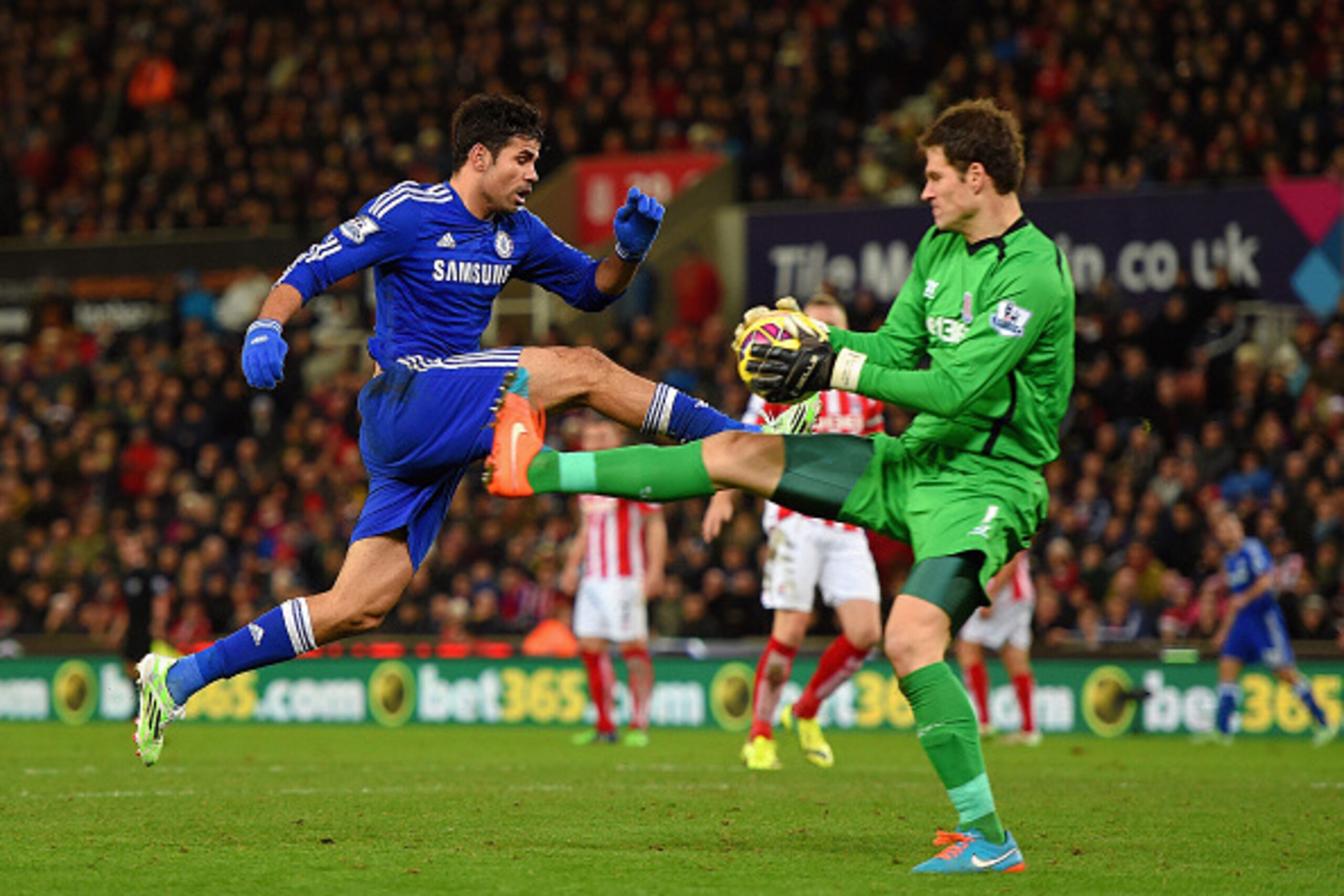STOKE ON TRENT, ENGLAND - DECEMBER 22: Asmir Begovic of Stoke City is challenged by Diego Costa of Chelsea during the Barclays Premier League match between Stoke City and Chelsea at Britannia Stadium on December 22, 2014 in Stoke on Trent, England. (Pho STOKE ON TRENT, ENGLAND - DECEMBER 22: Asmir Begovic of Stoke City is challenged by Diego Costa of Chelsea during the Barclays Premier League match between Stoke City and Chelsea at Britannia Stadium on December 22, 2014 in Stoke on Trent, England. (Pho