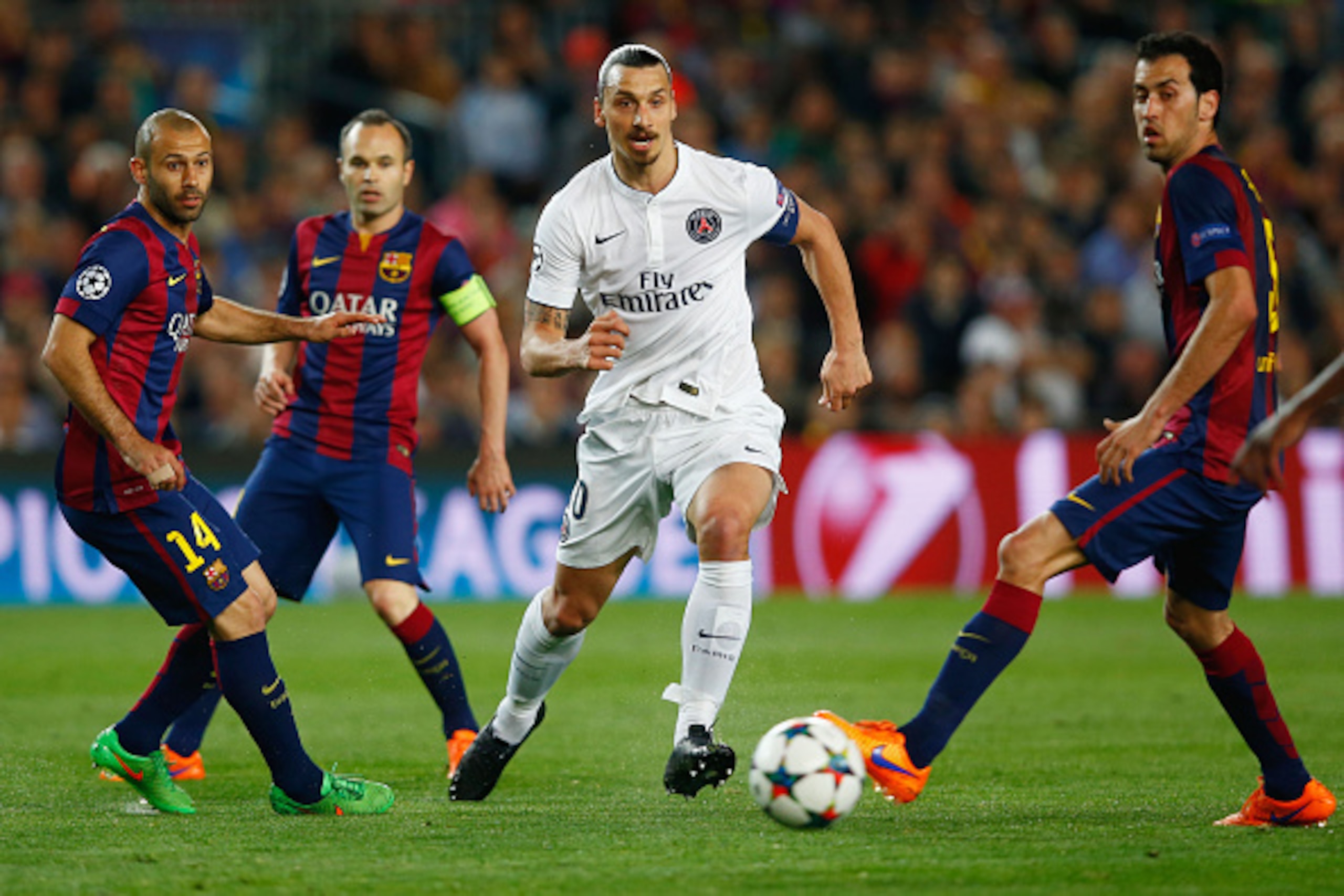 BARCELONA, SPAIN - APRIL 21: Zlatan Ibrahimovic of PSG takes on Javier Mascherano, Andres Iniesta and Sergio Busquets of Barcelona during the UEFA Champions League Quarter Final second leg match between FC Barcelona and Paris Saint-Germain at Camp Nou on BARCELONA, SPAIN - APRIL 21: Zlatan Ibrahimovic of PSG takes on Javier Mascherano, Andres Iniesta and Sergio Busquets of Barcelona during the UEFA Champions League Quarter Final second leg match between FC Barcelona and Paris Saint-Germain at Camp Nou on