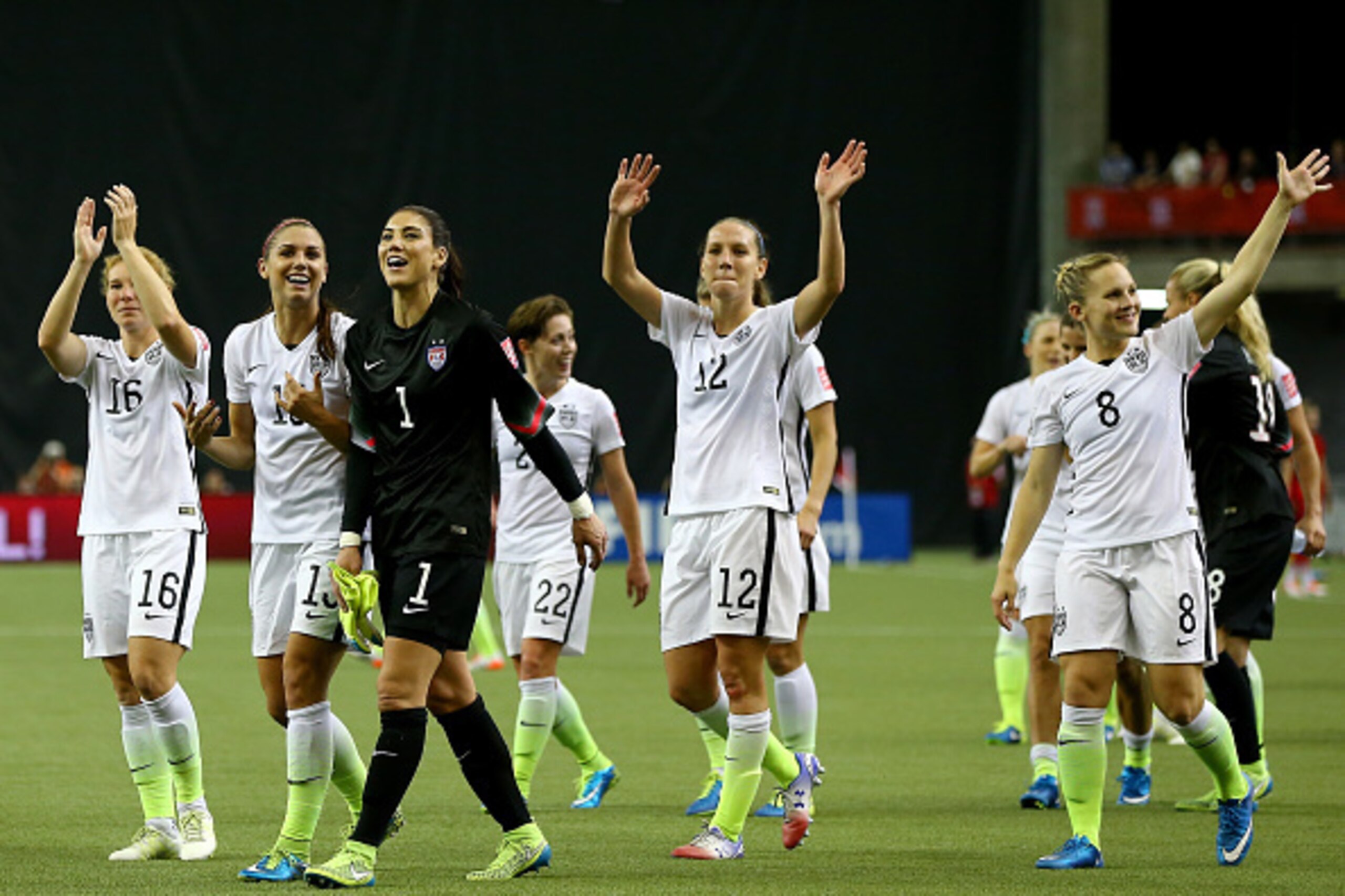 MONTREAL, QC - JUNE 30:  Alex Morgan #13, Hope Solo #1 and Lauren Holiday #12 of the United States celebrate the 2-0 victory against Germany in the FIFA Women's World Cup 2015 Semi-Final Match at Olympic Stadium on June 30, 2015 in Montreal, Canada.  (Pho