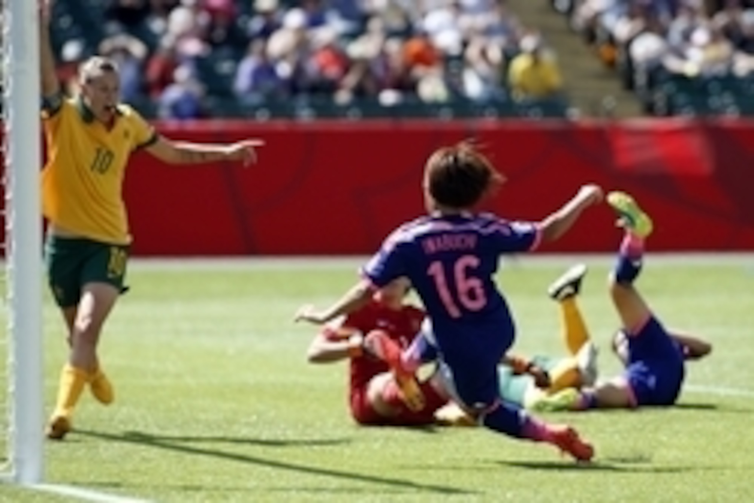 Jun 27, 2015; Edmonton, Alberta, CAN; Japan forward Mana Iwabuchi (16) scores as Australia midfielder Emily Van Egmond (10) defends during the second half in the quarterfinals of the FIFA 2015 Women's World Cup at Commonwealth Stadium. Mandatory Credit: E Jun 27, 2015; Edmonton, Alberta, CAN; Japan forward Mana Iwabuchi (16) scores as Australia midfielder Emily Van Egmond (10) defends during the second half in the quarterfinals of the FIFA 2015 Women's World Cup at Commonwealth Stadium. Mandatory Credit: E