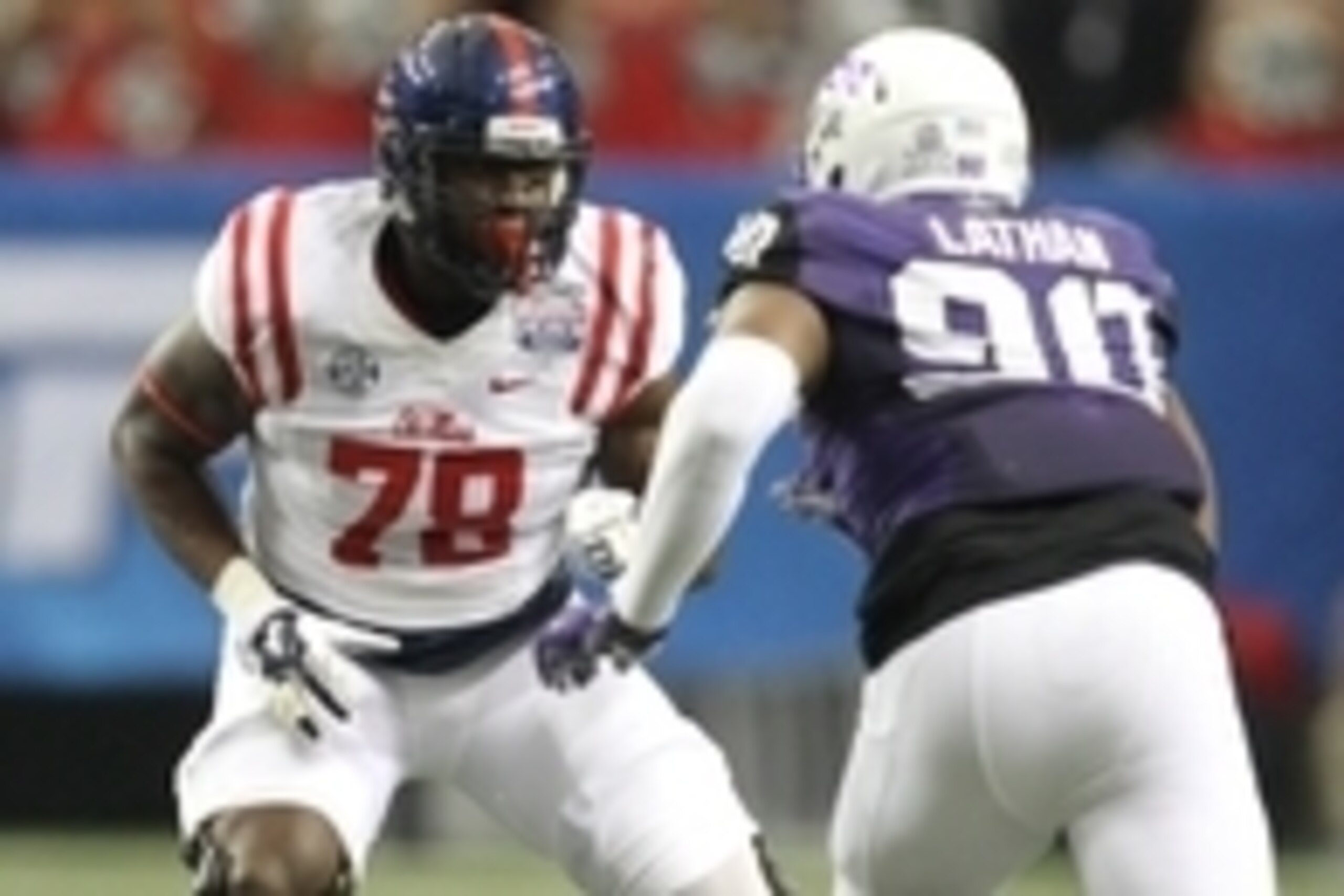 Dec 31, 2014; Atlanta , GA, USA; Mississippi Rebels offensive lineman Laremy Tunsil (78) prepares to block TCU Horned Frogs defensive tackle Terrell Lathan (90) during the first quarter in the 2014 Peach Bowl at the Georgia Dome. Mandatory Credit: Brett D Dec 31, 2014; Atlanta , GA, USA; Mississippi Rebels offensive lineman Laremy Tunsil (78) prepares to block TCU Horned Frogs defensive tackle Terrell Lathan (90) during the first quarter in the 2014 Peach Bowl at the Georgia Dome. Mandatory Credit: Brett D