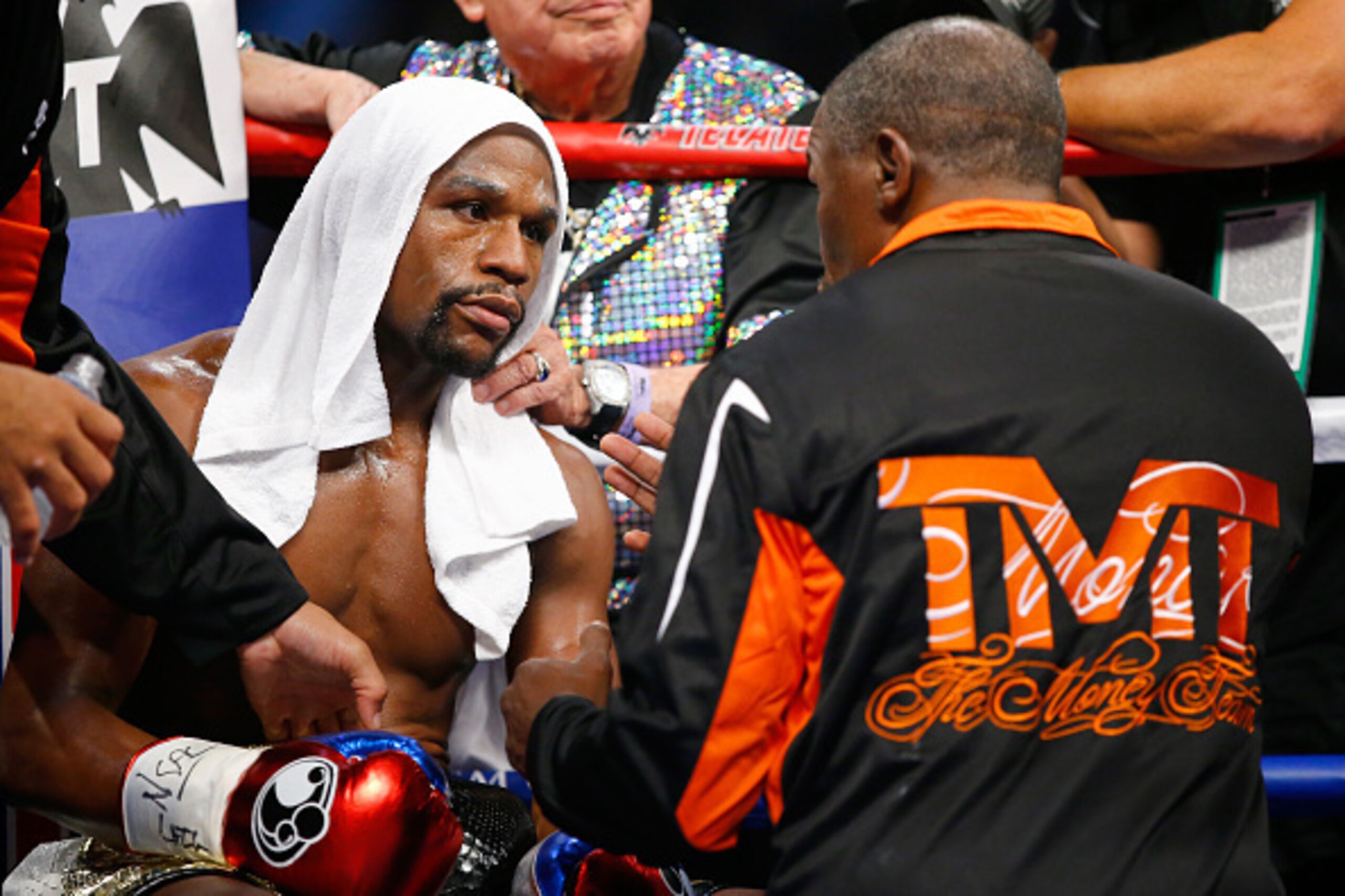 LAS VEGAS, NV - MAY 02: Floyd Mayweather Jr. and his trainer Floyd Mayweather Sr. talk in-between rounds during the welterweight unification championship bout on May 2, 2015 at MGM Grand Garden Arena in Las Vegas, Nevada. (Photo by Al Bello/Getty Images LAS VEGAS, NV - MAY 02: Floyd Mayweather Jr. and his trainer Floyd Mayweather Sr. talk in-between rounds during the welterweight unification championship bout on May 2, 2015 at MGM Grand Garden Arena in Las Vegas, Nevada. (Photo by Al Bello/Getty Images